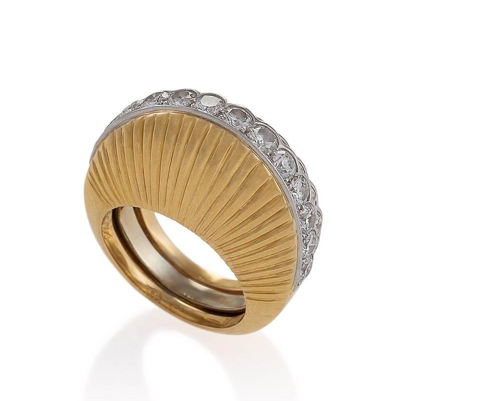 This architectural stepped gold and diamond ring by Cartier Paris presents a clever and sparkling commentary on artistry and illusion. From different viewpoints, this Retro ring is alternately a sculptured triple diamond band of escalating stepped