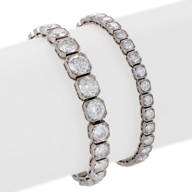 A French Art Deco platinum and diamond convertible necklace. The necklace has 57 old European-cut box set diamonds with an approximate total weight of 30.00 carats, H/I color, VS clarity, with a center diamond weighing approximately 2.00 carats, H/I
