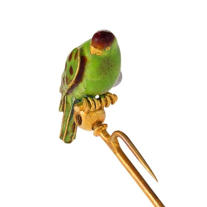 An English Late 19th Century 18 karat gold and enamel Hat Pin by Carlo Giuliano. The hat pin/brooch is a realistically rendered representation of a spotted pigeon. With original signed fitted box. Circa 1900.

Signed, 