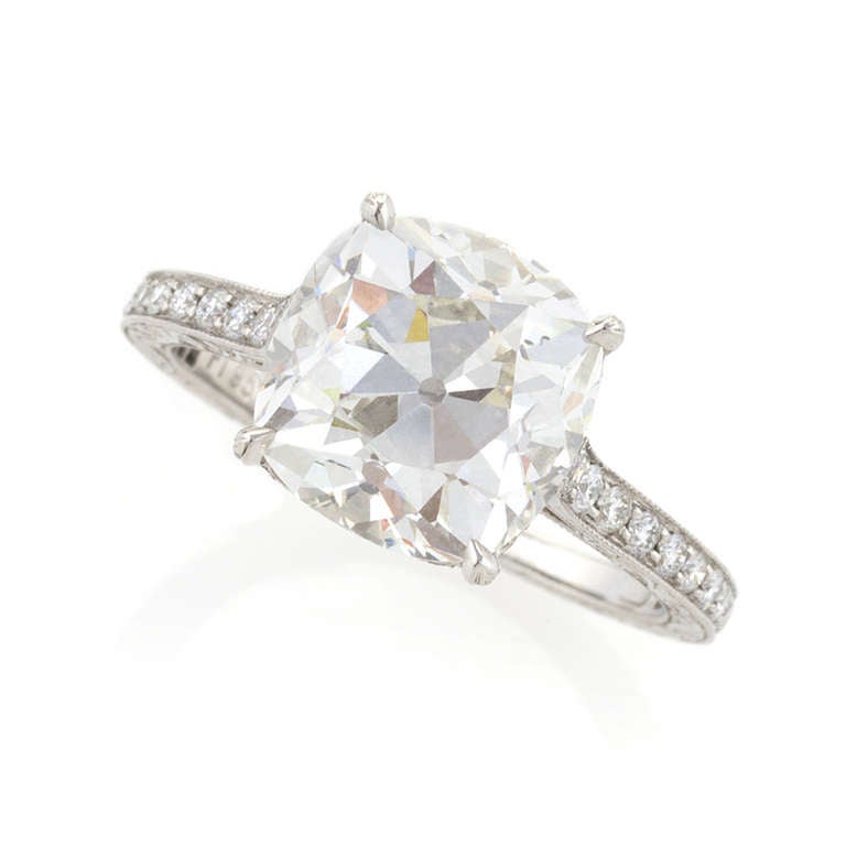 An elegant antique cushion-cut diamond set in a platinum handmade mounting. The ring centers on an antique cushion-cut diamond that weighs 4.07 carats, I color, VS2 clarity. The mounting is a new handmade custom designed ring for Macklowe Gallery.