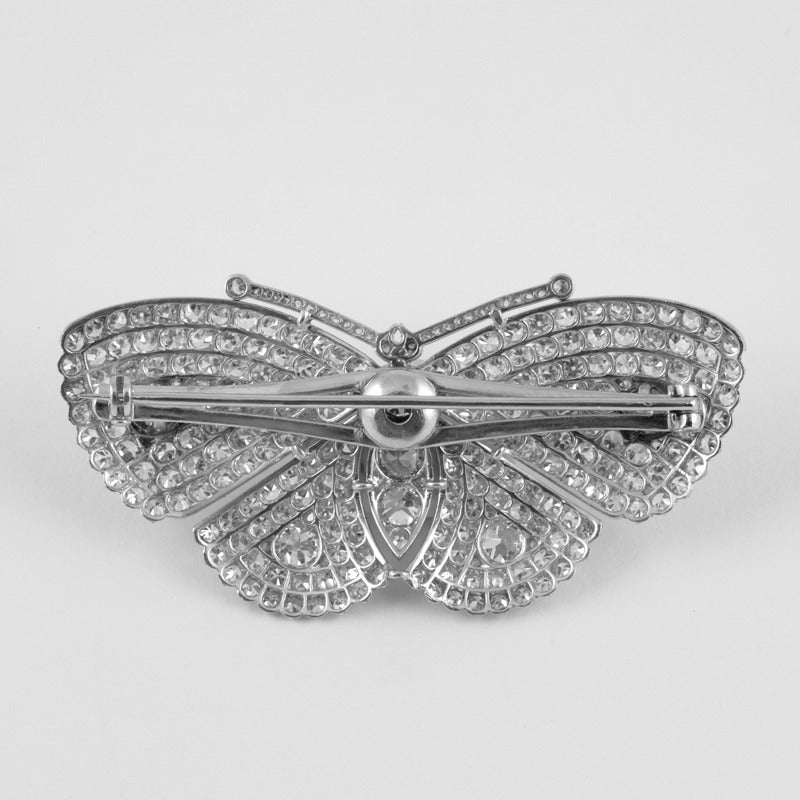 An Art Deco platinum brooch with diamonds. The brooch has  6 old European-cut diamonds with an approximate total weight of 1.20 carats, 1 old European-cut diamond with an approximate total weight of .50 carats, 236 single-cut diamonds with an