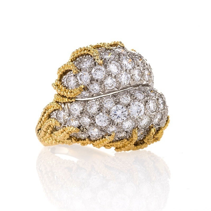 A Mid-20th Century 18 karat gold and platinum ring with diamonds.  The ring has 66 round-cut diamonds with an approximate total weight of 4.60 carats, G-H color, VS clarity. The 3 dimensional ring is designed in a yin-yang motif with diamonds set in