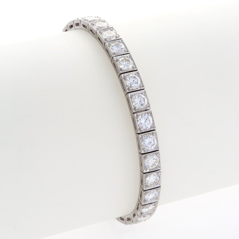 A Mid-Century platinum line bracelet with diamonds. The bracelet has 32 round-cut box-set diamonds with an approximate total weight of 14.50 carats.  

Circa 1940’s-50’s. 

Signed, #2249 plat. 

(MG #15005)