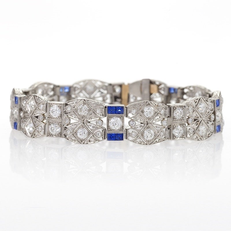 An American Art Deco platinum bracelet with diamonds and blue sapphires by C.D. Peacock. The bracelet features  95 old European-cut diamonds with an approximate total weight of 6,25 carats, and  20 French cut blue sapphires with an approximate total