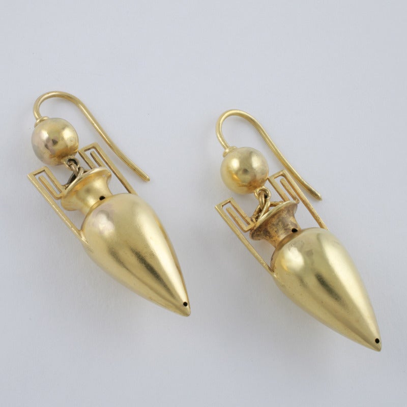 A pair of English Antique 15 karat gold earrings. The earrings are of a classical amphora motif with an antique bloomed surface finish. Circa 1880. 

(MG #15487)