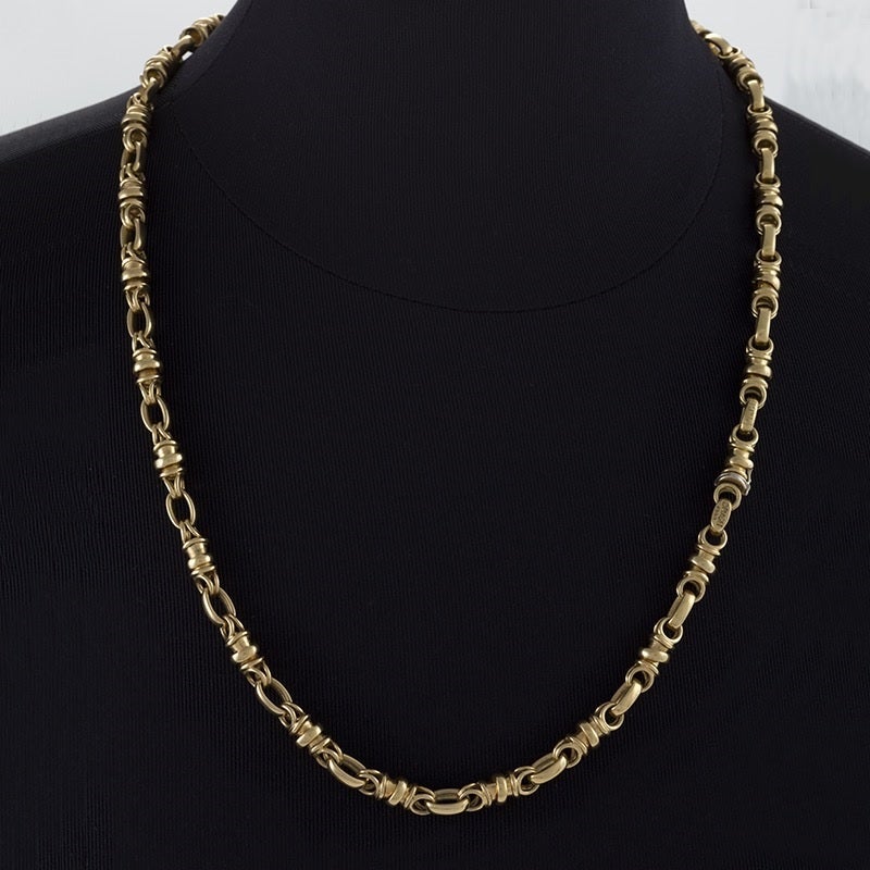 A French Late-20th Century 18 karat gold necklace by Piaget. The long Byzantine motif necklace breaks into a bracelet and shorter necklace with two clasps.  
Circa 1990. 

Signed, “Piaget 1990”. 

(MG #17076)