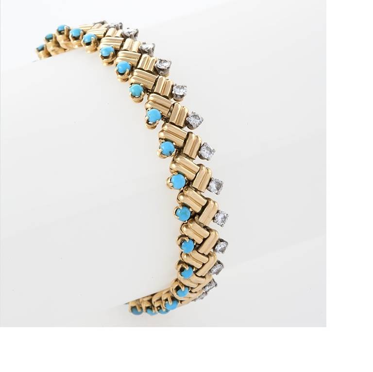 A French Mid-20th Century 18-karat gold bracelet with turquoise and diamonds by Van Cleef & Arpels. The bracelet has 30 cabochon turquoise stones, and 30 round-cut diamonds with an approximate total weight of 3.00 carats. 'Grain of Rice' bracelet.