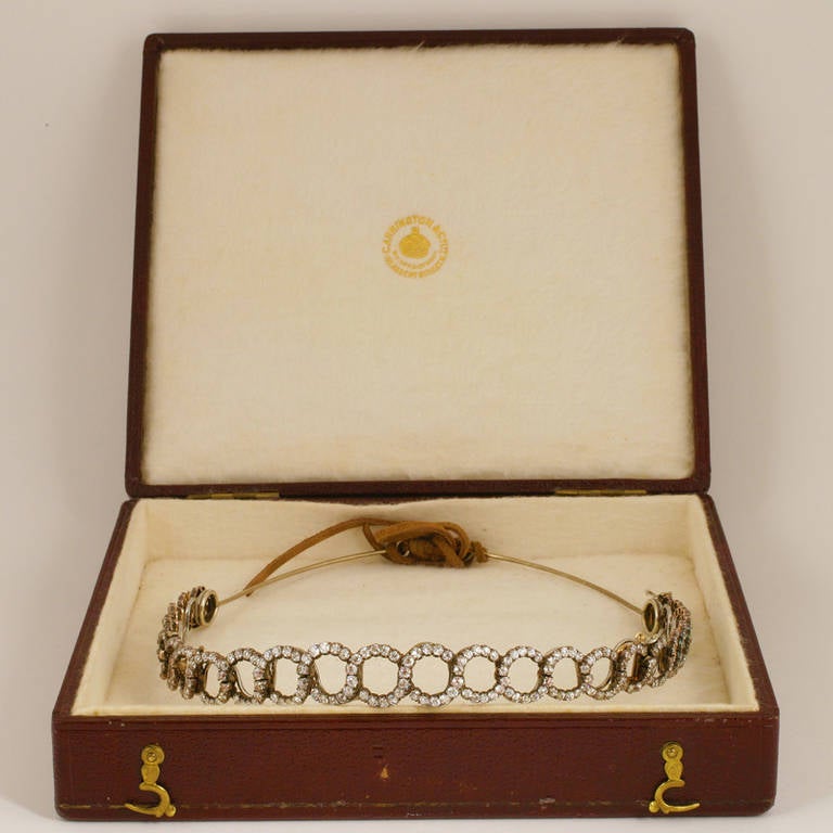 Originally retailed by Carrington & Co, London, the convertible choker/necklace/ bracelet/bandeau/headband comes with its original box and headband frame to which the necklace is attached with small screws. The necklace is composed of old-mine and