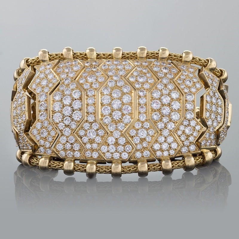 A French late-20th century 18 karat gold bracelet with diamonds by René Boivin. The bracelet has 323 round-cut diamonds with an approximate total weight of 41.35 carats with a VS clarity and F/G color grade. Circa 1980. 

 “...The Hindu bracelets