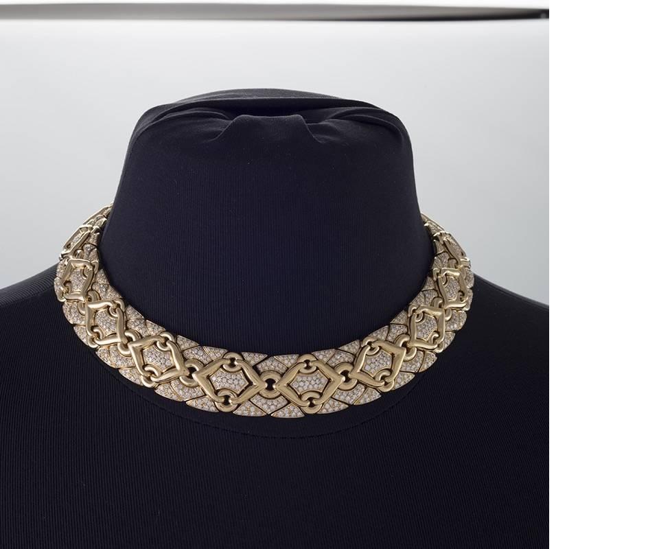 An Italian Late-20th Century 18 karat gold necklace with diamonds by Bulgari. The necklace has 1072 round-cut diamonds with an approximate total weight of 18.00 carats, F/G color, VS clarity.  The “Trika”--Greek for braid-- necklace is composed of