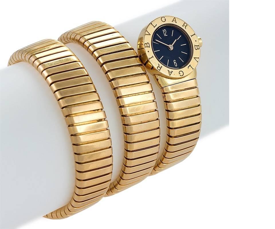 An Italian 18 karat gold Serpenti watch by Bulgari. The tubogas yellow gold bracelet has a double spiral ending in the classic black dial. With original signed Bulgari box and original papers from Bulgari dated 2008. Quartz movement.  Circa