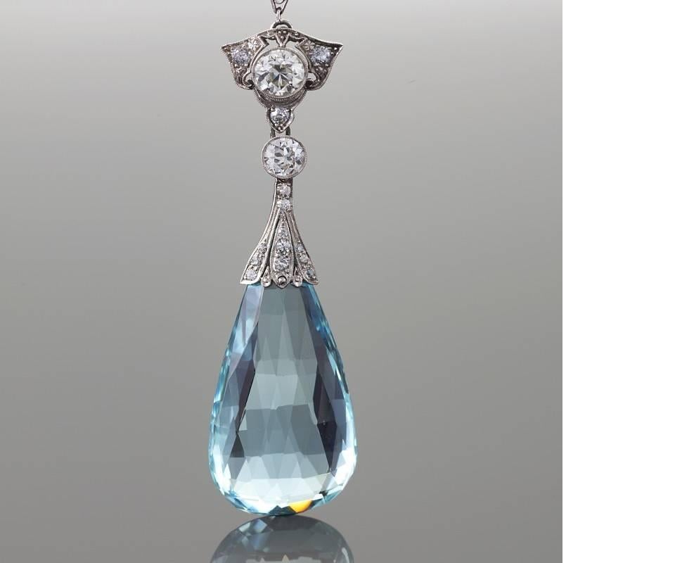 An Edwardian platinum necklace with aquamarine and diamonds. The necklace has a briolette aquamarine, and two old European-cut diamonds with an approximate total weight of 1.00 & .50 carats and 13 old European cut diamond with an approximate total