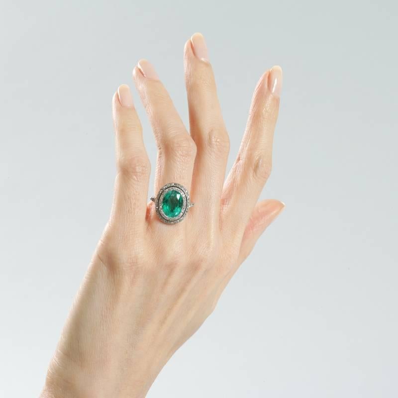 Colombian Emerald and Diamond Halo Ring  In Excellent Condition In New York, NY
