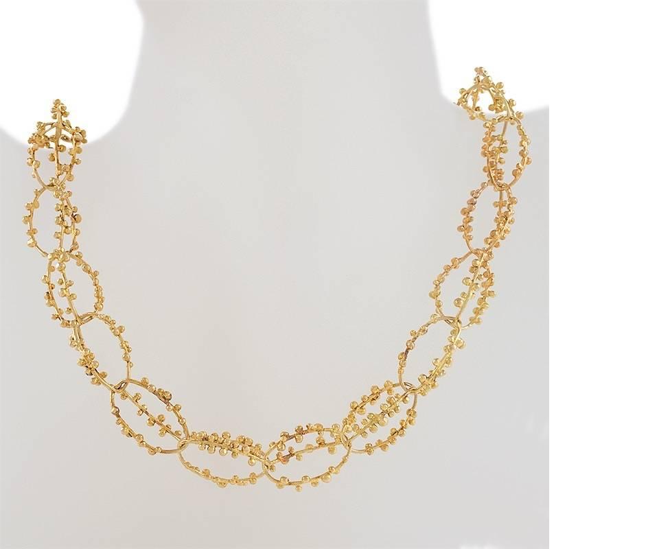 A Late-20th Century 18 karat gold chain by Spitzer and Furman. The chain contains 50 links designed in a modernist motif. Circa 1970.

Spritzer and Furman had many retail stores throughout the Caribbean and New York, Primarily known for their