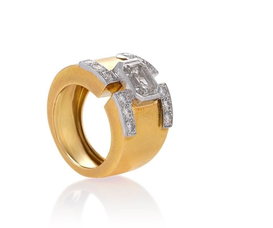 An American Mid-20th Century gold and platinum ring with diamonds by David Webb. The ring has a bezel set Asscher cut diamond with an approximate total weight of 2,55 carats, H/I color, VS clarity, and 12 round diamonds with an approximate total