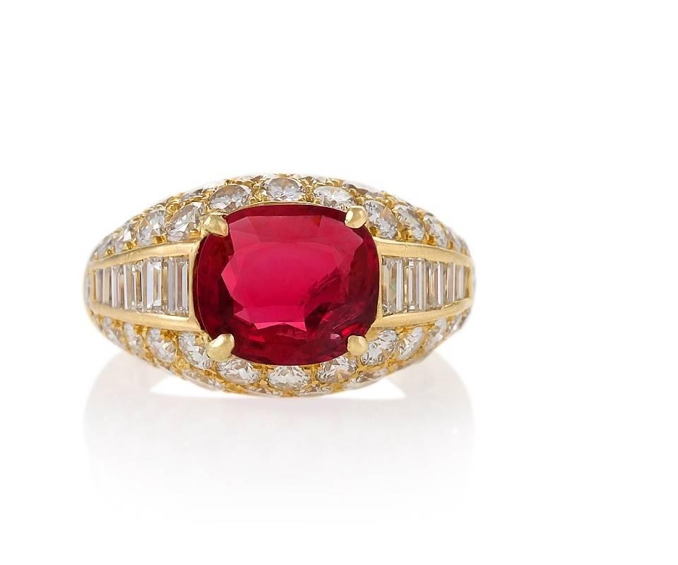 An 18 karat gold “Trombino” ring with ruby and diamonds by Bulgari. The ring has a cushion-cut ruby with a weight of 2.34 carats, 12 baguette diamonds and 48 round diamonds with an approximate total weight of 2.72 carats, G/H color and VS clarity