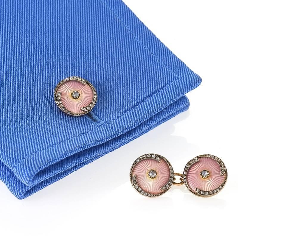A pair of Russian, Late-19th Century, 14 karat gold (56 gold standard), enamel and silver cuff links with diamonds made by  Erik August Kollin, workmaster. The  cuff links have 88 rose-cut diamonds with an approximate total weight of .60 carats.