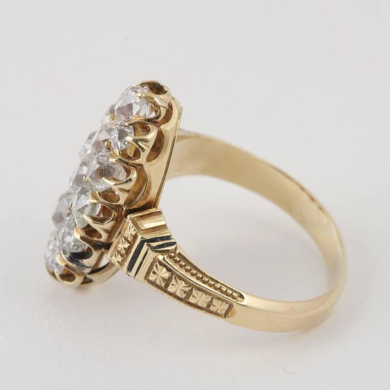 A Victorian 18 karat gold and diamond ring. The navette ring is composed of 15 old European-cut diamonds with an approximate total weight of 1.75 carats, prong set, forming a marquise shape. Circa 1880's.

Size 7; this ring can be sized. 