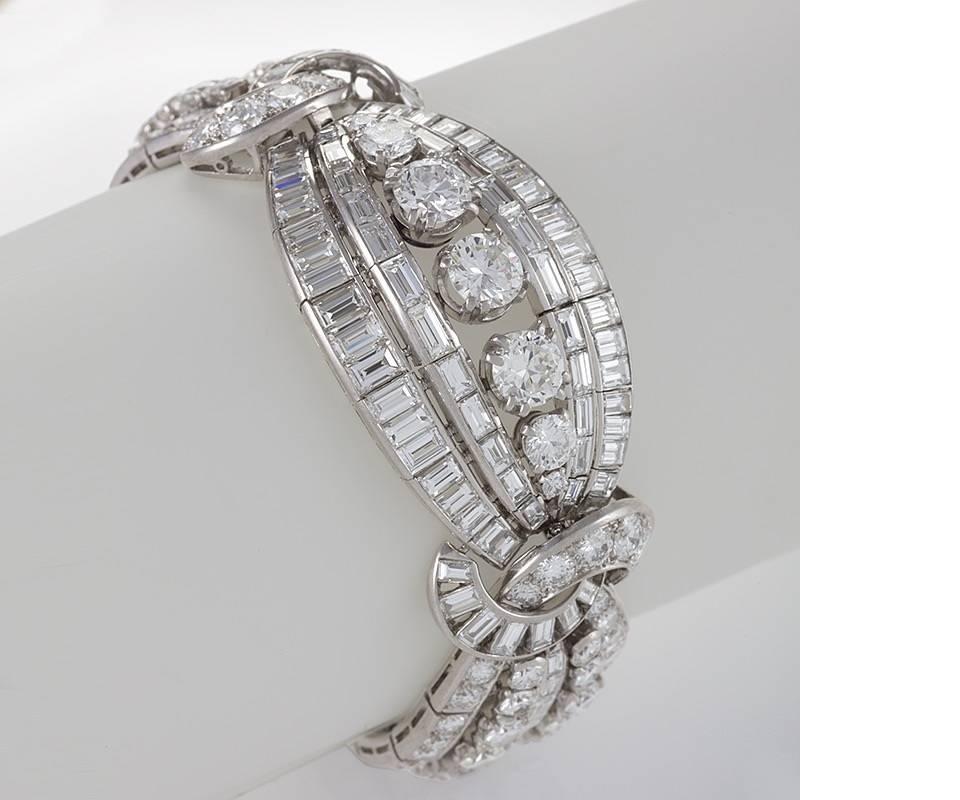A very fine French Retro platinum bracelet with diamonds by Mellerio dits Meller. The bracelet contains 153 round-cut diamonds and 104 baguette-cut diamonds with an approximate total weight of 43.35 carats, F/G color and VS clarity.  The bracelet is