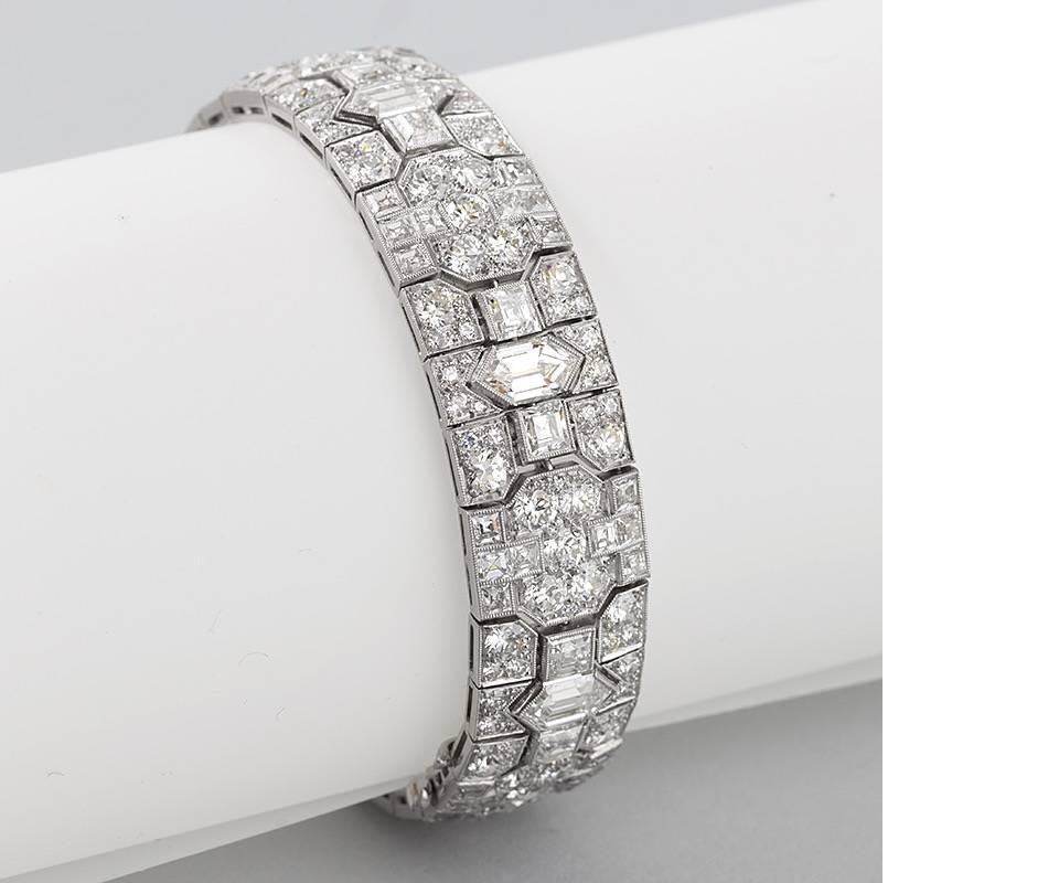 An American Art Deco platinum bracelet with diamonds by Tiffany & Co. The bracelet has 7 large fancy-cut diamonds with an approximate total weight of .90 carats each totaling 6.30 carats, 70 square-cut diamonds with an approximate total weight of