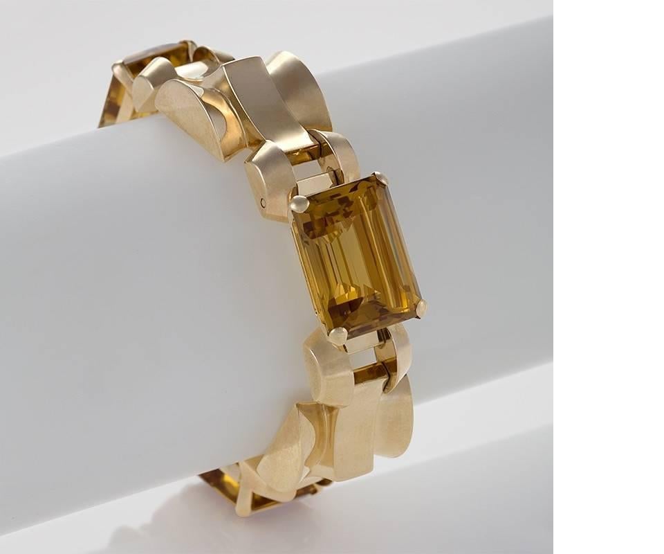 An American Retro 14 karat gold and citrine bracelet by Tiffany & Co. The bracelet has 3  rectangular-cut citrines with an approximate total weight of 58.50 carats. The bracelet is composed of 6 links of alternating citrines set and gold