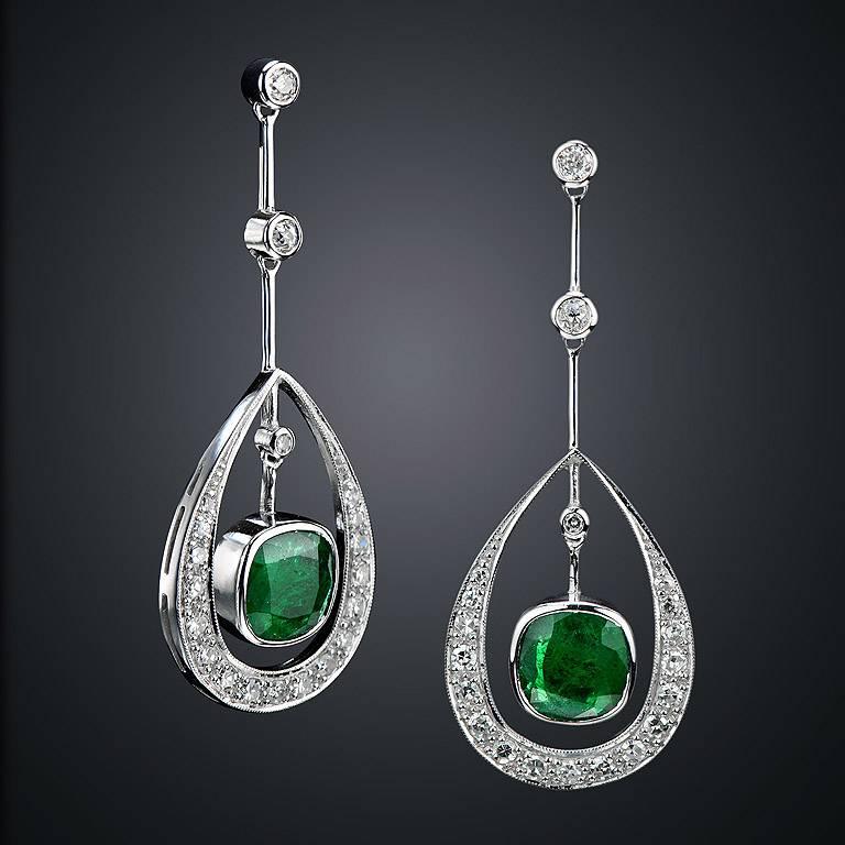 Art Deco Style Earrings set with perfect pair Zambian Emerald 4.28 Carat.  Diamond total content is 1.31 Carat.  The earrings were made of 18K White Gold with Butterfly Stud.