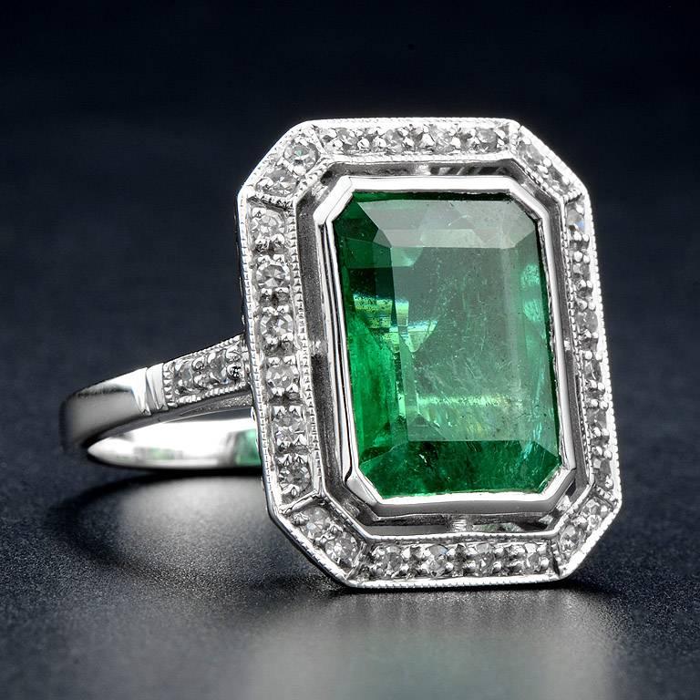 Zambian Emerald weight 6.401 Carat certified by Emil #80404-1 set with 0.30 Carat Diamond on 18K White Gold Ring.  Emerald is very clear and has very few inclusion.

The ring was made in size US#7