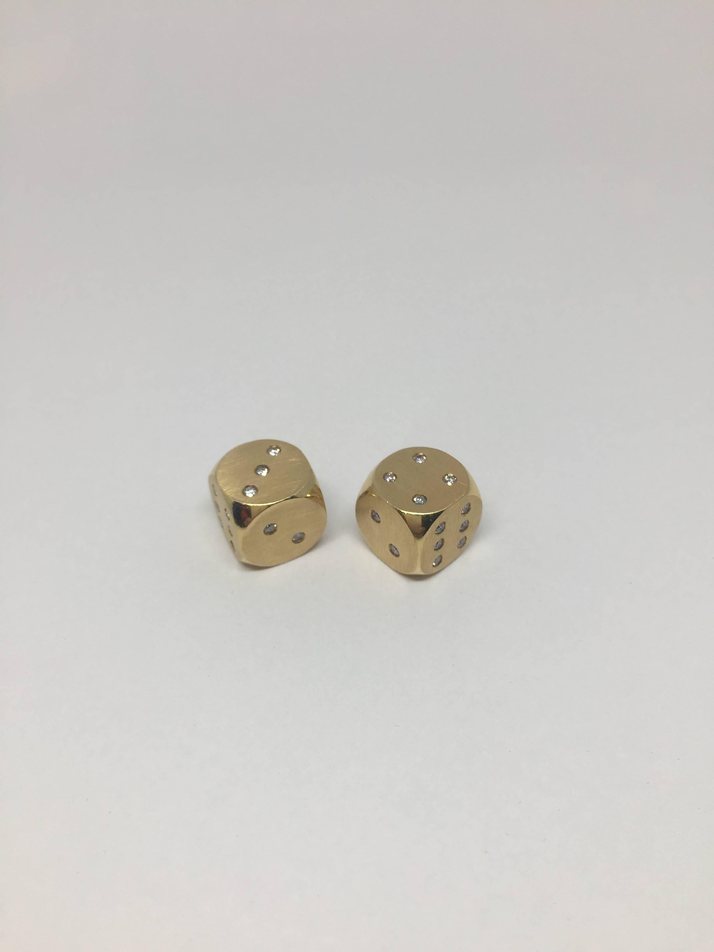 Exquisitely crafted, hand made dices numbered with 1,20 ct diamonds. Sold in pairs as shown. Enamel details on the logo. 
