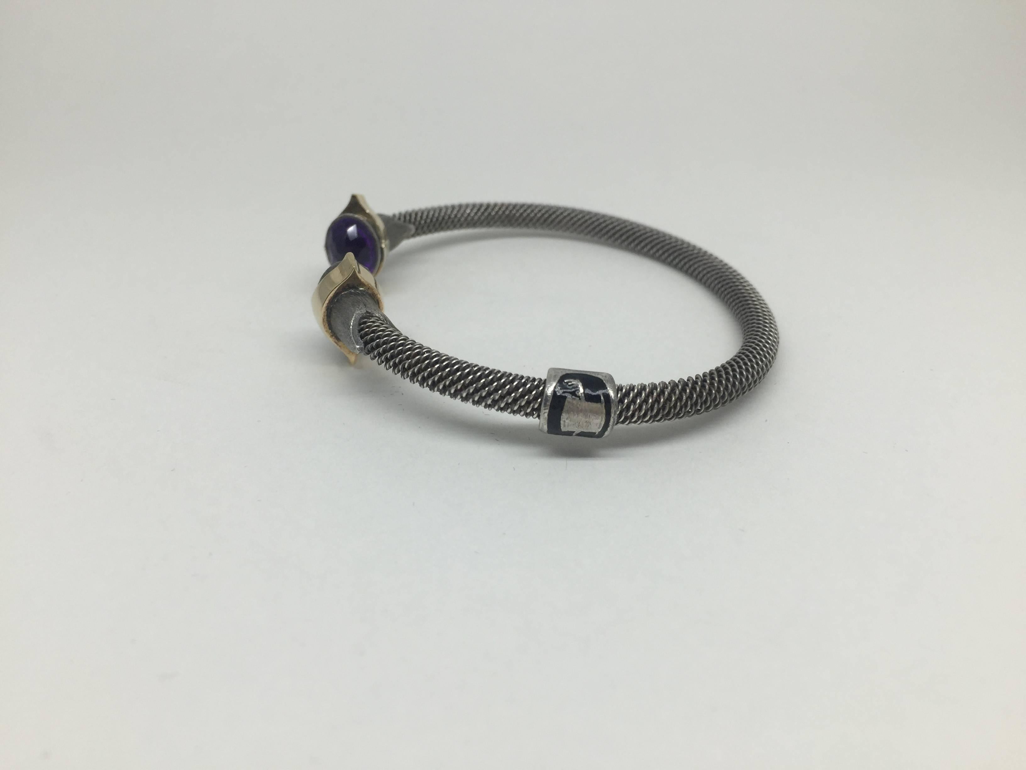 Hand braided 925 sterling silver and hand made amethyst bracelet with 18K rose gold and sterling silver details.


