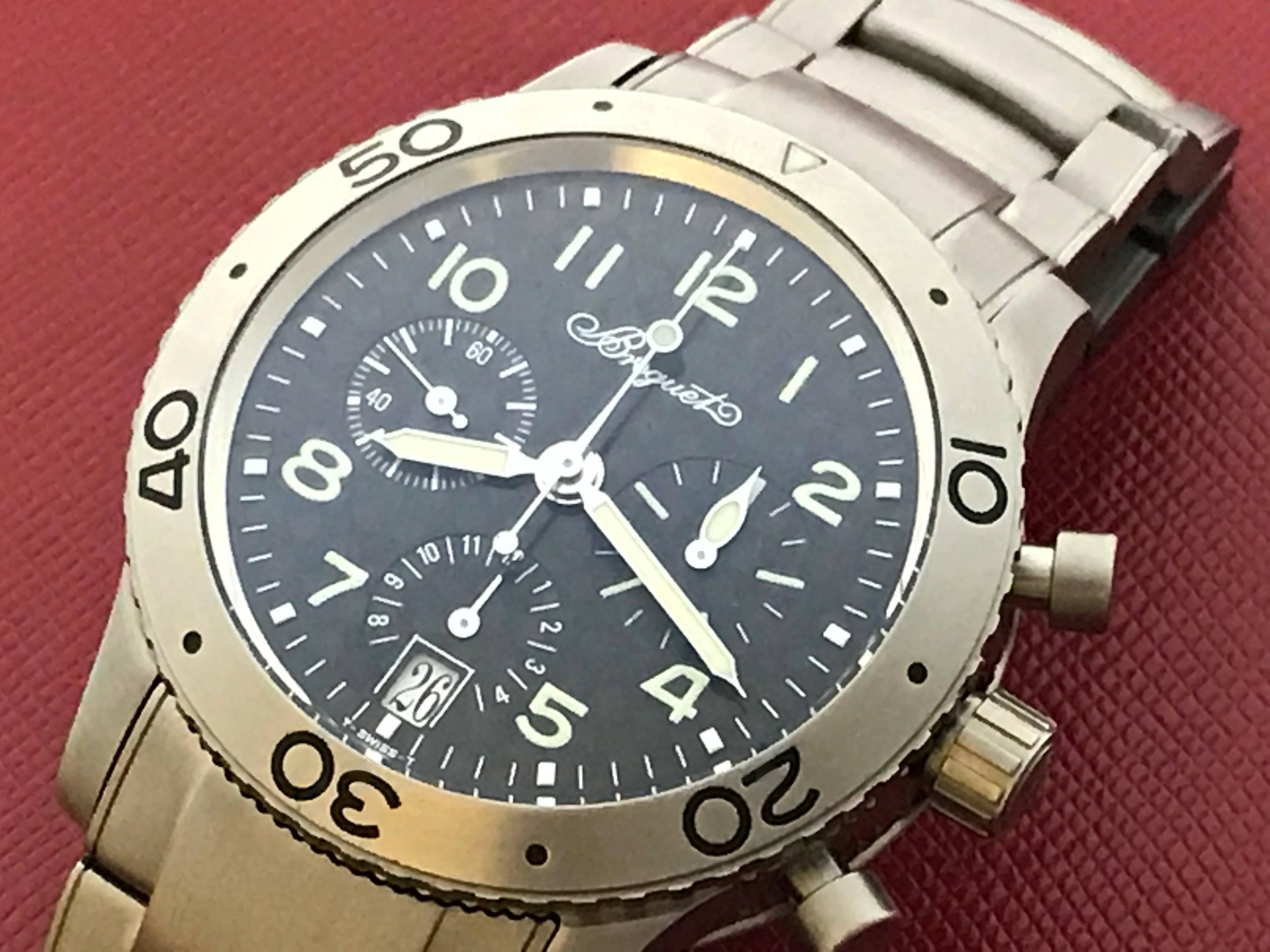 Very nice pre-owned genuine Breguet Transatlantic Chronograph Type XX Model 3820TI/K2/TW9 men's automatic stainless steel wrist watch. Charcoal black carbon fiber dial with luminous Arabic numerals, with a Titanium round waterproof style case.