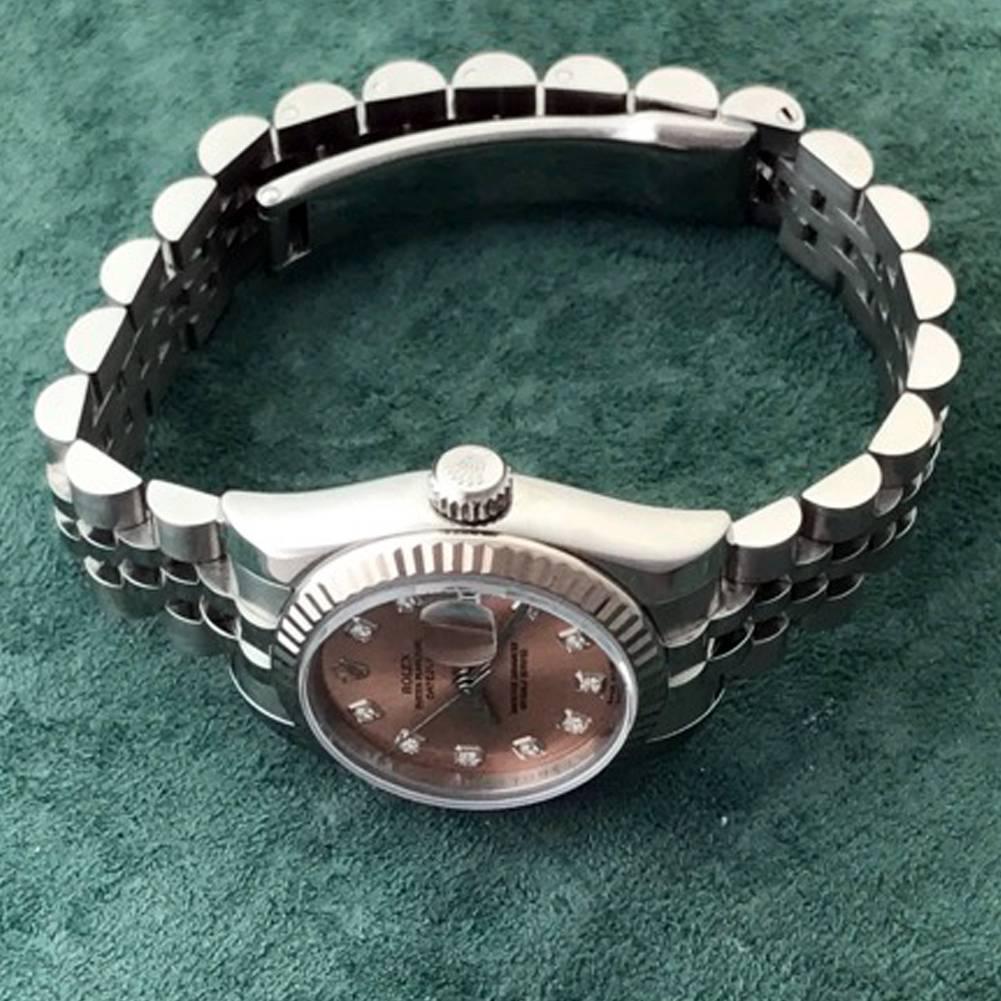 Manufacturer: Rolex
Model Name: Datejust
Model Number: Model 179174
Gender: Ladies
Movement: Automatic Winding
Movement Details: Oyster Perpetual
Case: Stainless Steel case with 18k White Gold fluted bezel (26mm dia.)
Bracelet: Stainless Steel