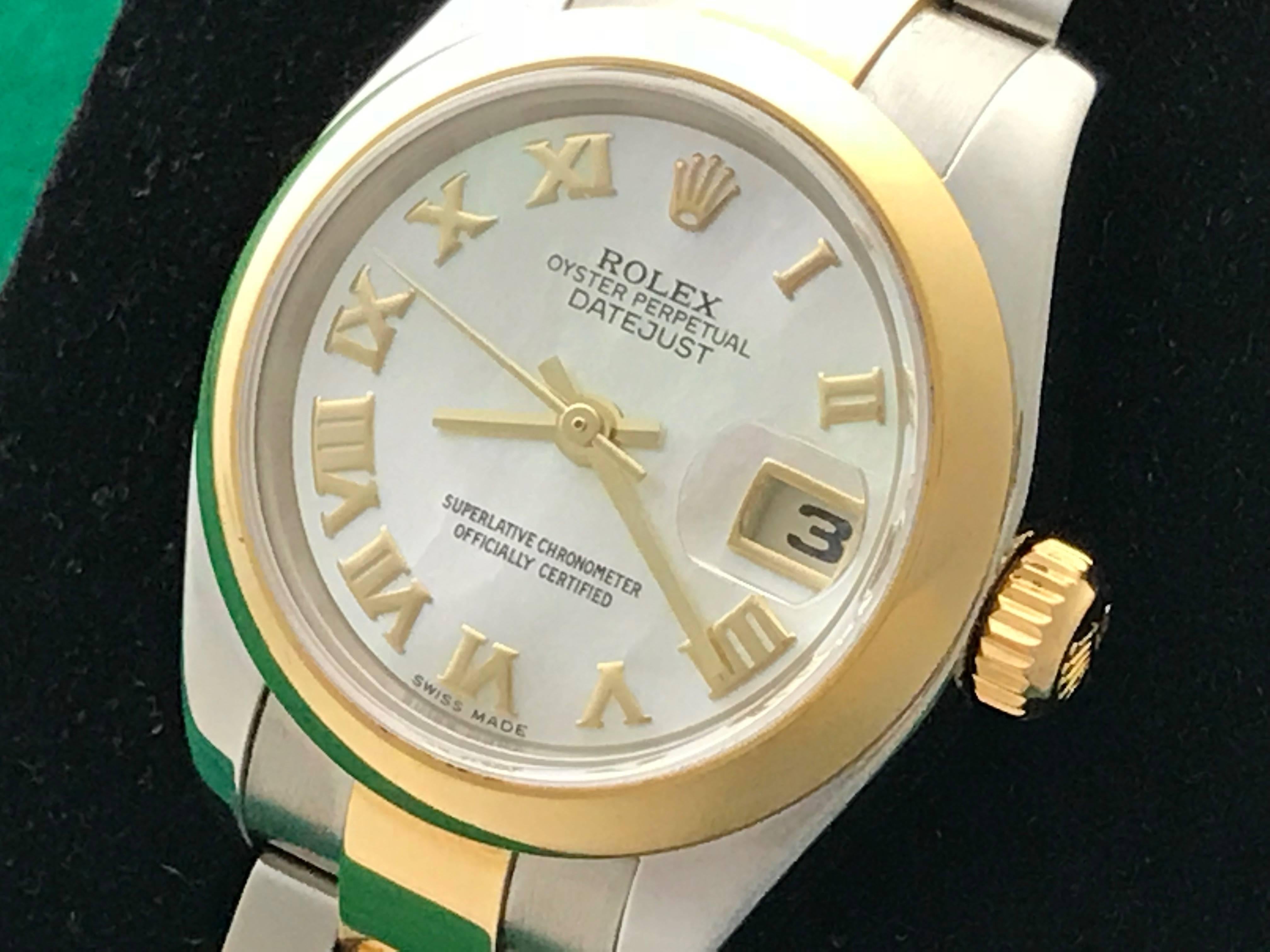 Manufacturer: Rolex
Model Name: Datejust
Model Num: Model 179163
Condition: Pre Owned
Watch Category: Contemporary
Gender: Ladies
Movement Comment: Oyster Perpetual
Movement: Automatic Winding
Dial: Rolex Mother of Pearl Dial with yellow gold Roman