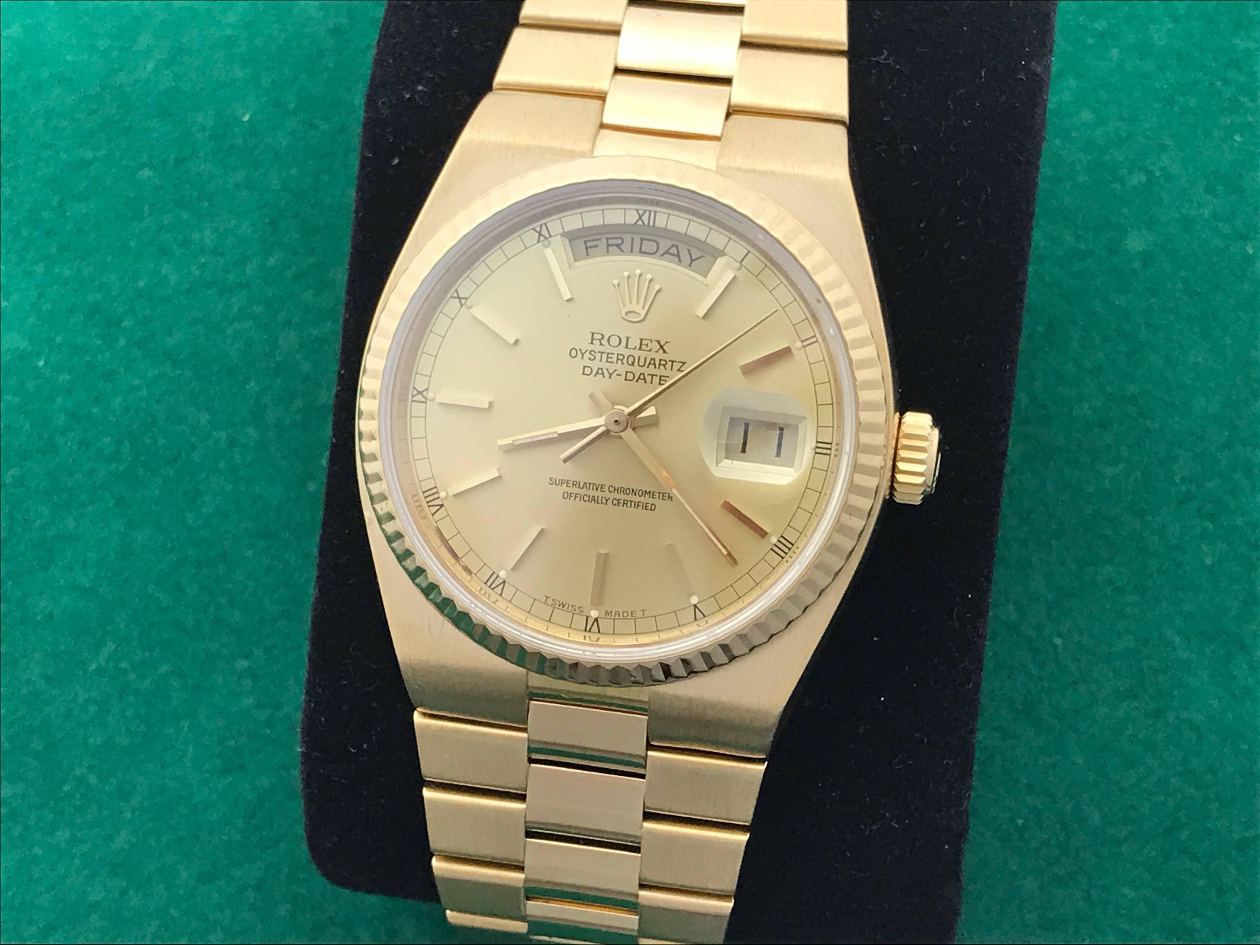 Manufacturer: Rolex
Model Name: President Day-Date
Model Number: Model 19018
Gender: Mens
Movement: Quartz
Movement Details: OysterQuartz Day-Date
Case: 18k Yellow Gold case with fluted bezel (35mm dia.)
Bracelet: 18k Yellow Gold integrated hidden