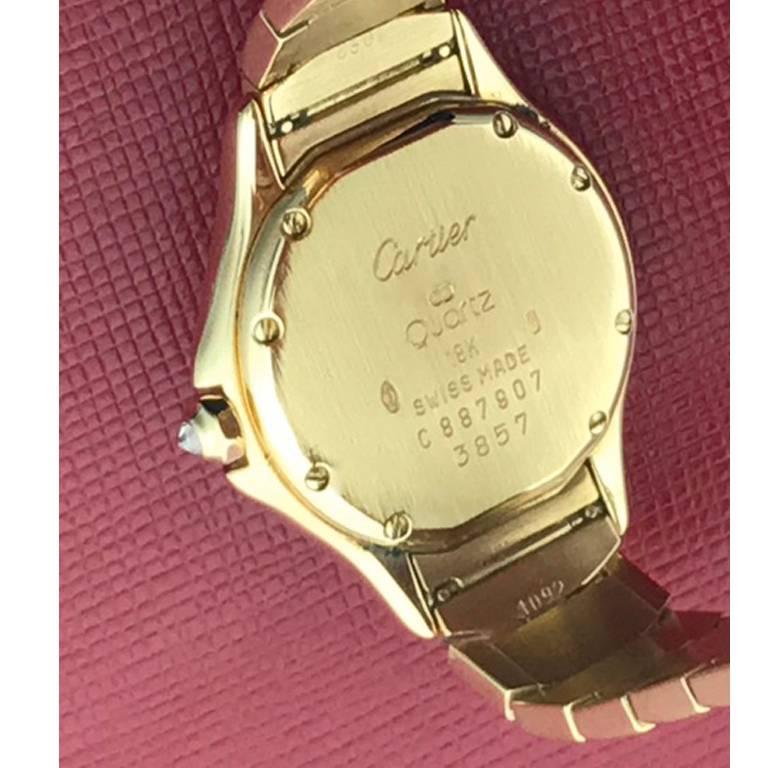 Cartier Cougar Ladies 18K Yellow Gold Quartz Wrist Watch.  Certified pre-owned and ready to ship.  Quartz movement with date.  18K Yellow Gold round case with Diamond bezel and lugs.  Measures 27mm (not including crown).  18K Yellow Gold Cartier