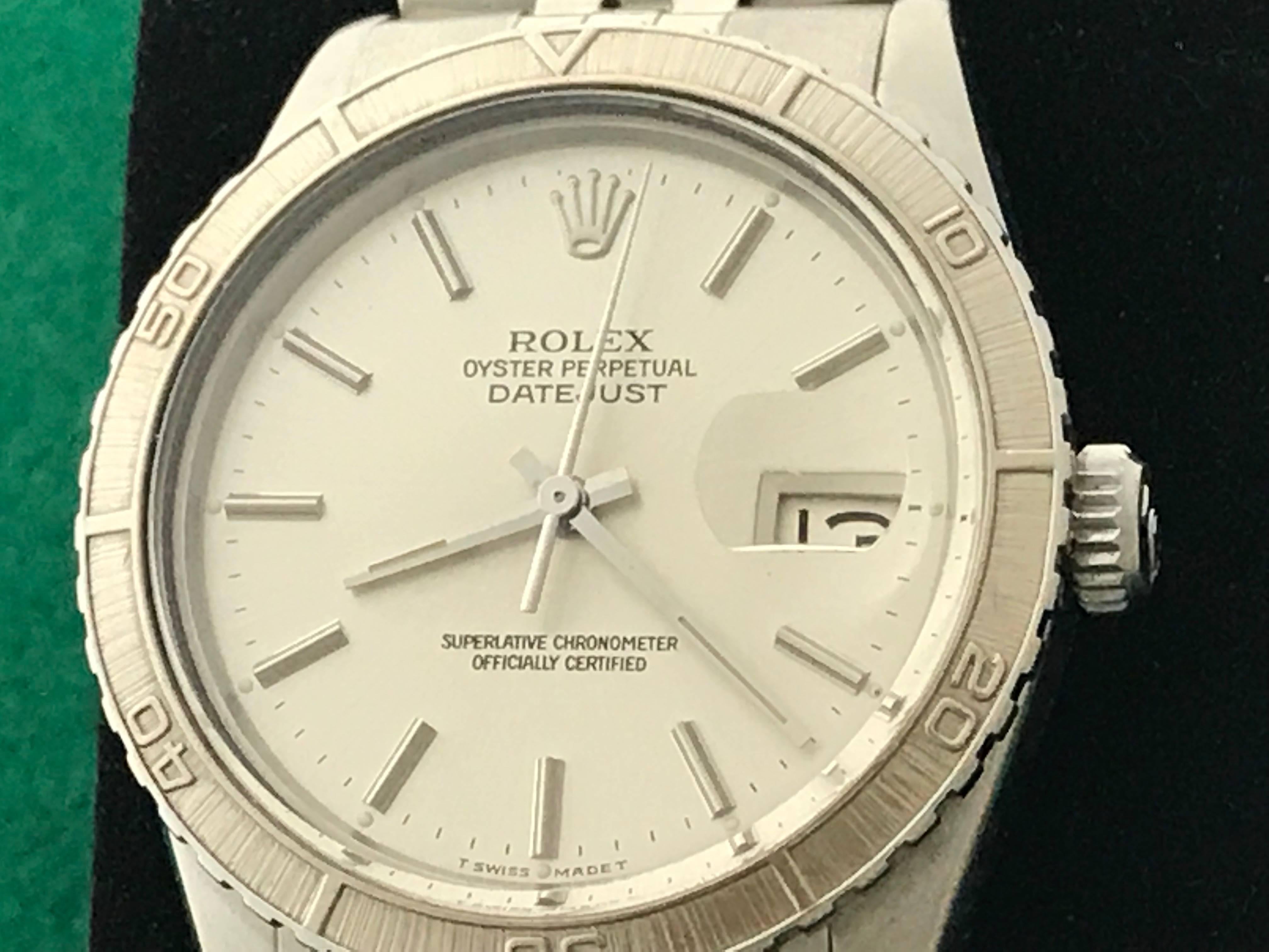 The Rolex Datejust Model 16250 pre-owned men's automatic wrist watch. Certified pre-owned and ready to ship.  Featuring an oyster silver dial with polished hour markers and stainless steel case with 18k white gold Thunderbird bezel. Measures 36mm.