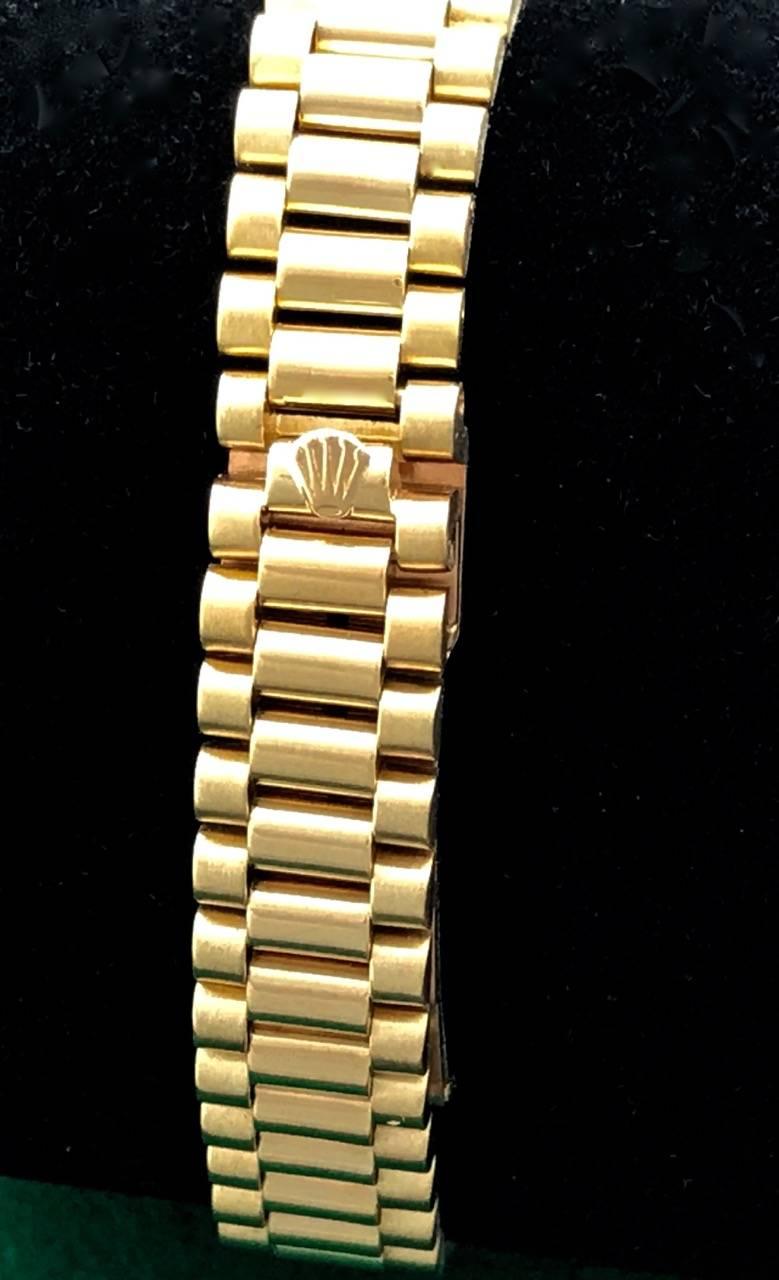 A beautiful ladies Rolex President at a great price.  This model 67198 is 18K Yellow Gold with a custom Diamond bezel and a Champagne dial with custom Diamond hour markers.  The bracelet is an 18K Yellow Gold Rolex President bracelet with all links