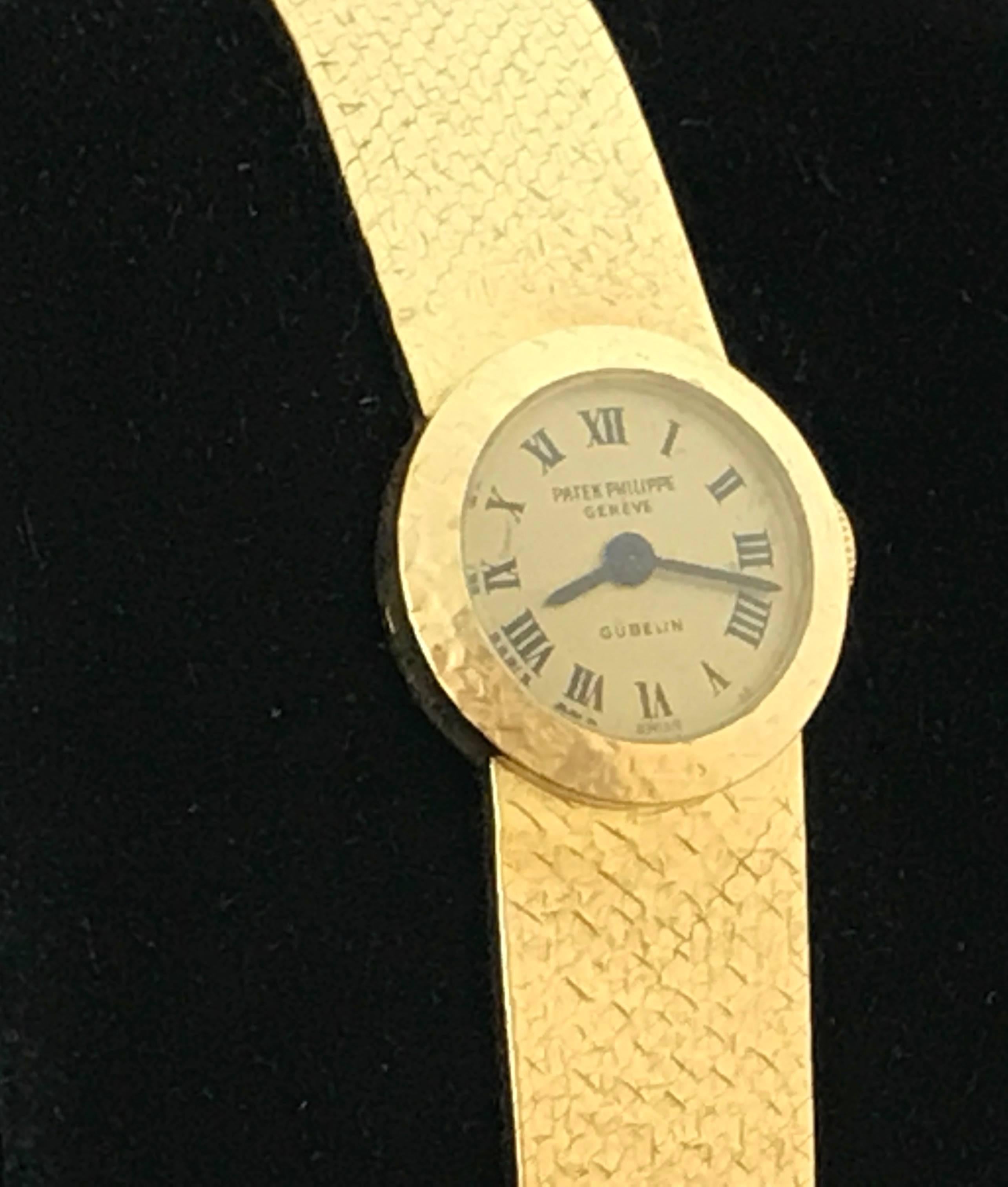 Patek Philippe Ladies 3266 Wrist Watch in 18K Yellow Gold. This is an heirloom piece you can pass down for generations.  This timepiece features an 18K Yellow Gold round case, measuring 17mm in diameter.  18k Yellow Gold integrated Patek Philippe