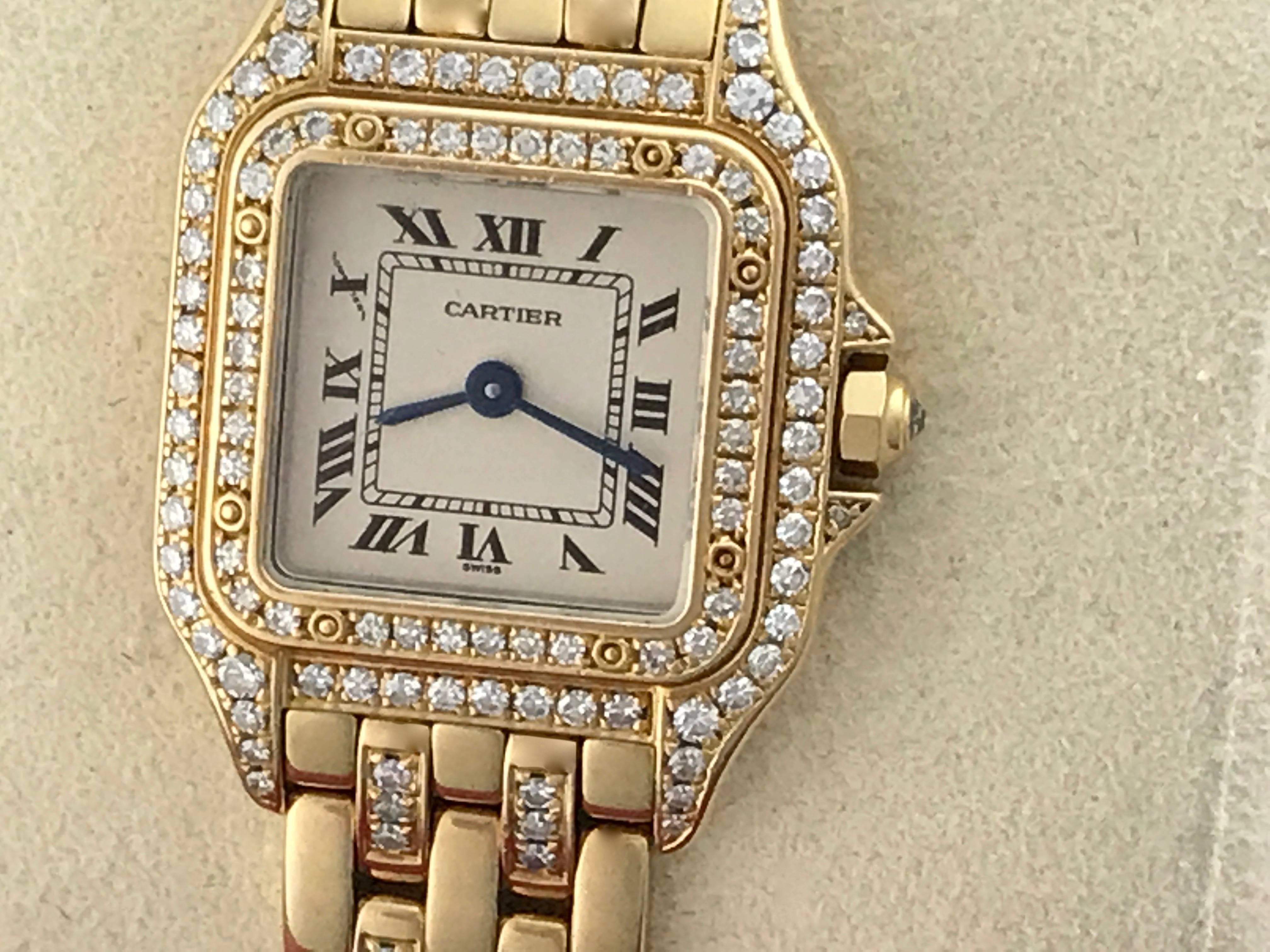 Cartier Ladies Panther 18K Yellow Gold ladies diamond wrist watch. As new, Certified pre-owned and ready to ship.  Quartz movement, 18K Yellow Gold square case with diamonds.  18K Yellow Gold Cartier bracelet with diamonds. White dial with black