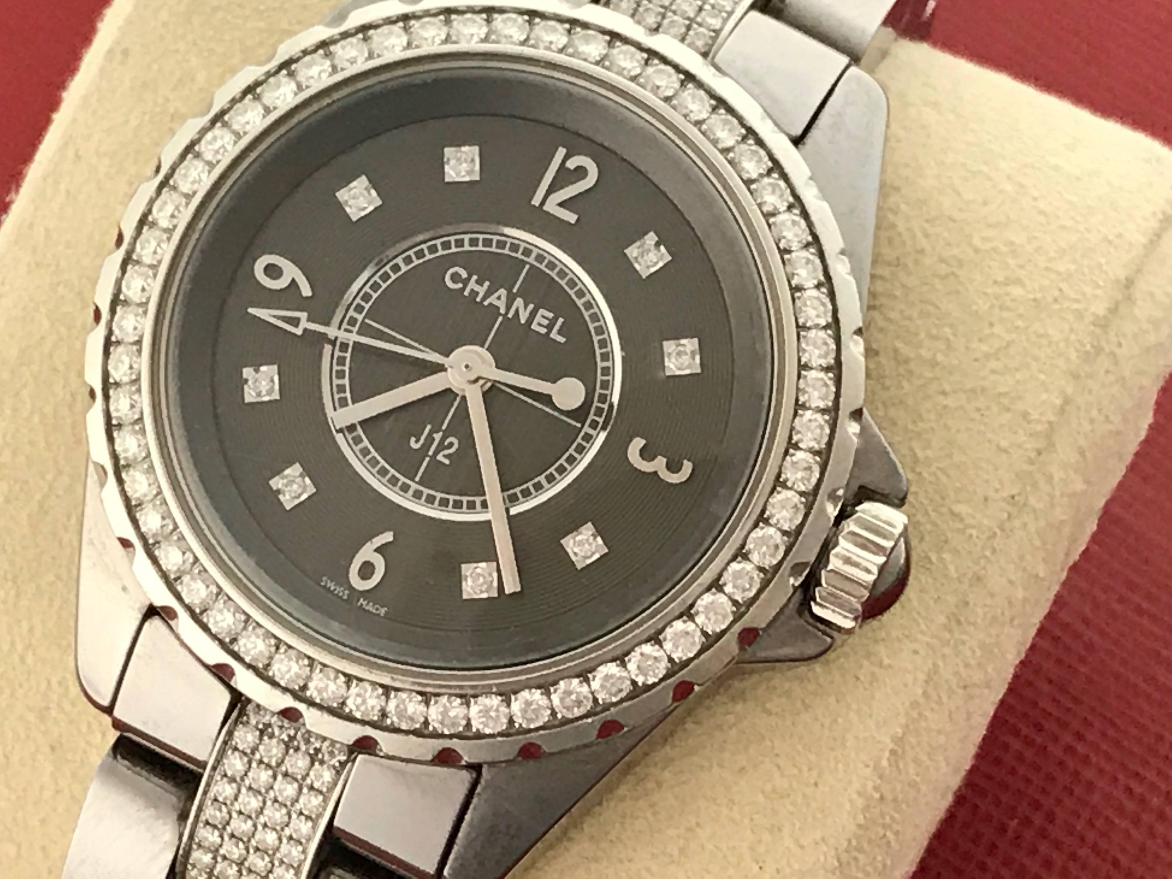 As New Midsize Chanel J12 Model H3106 Chromatic Titanium Ceramic wrist watch. Certified pre-owned and ready to ship.  Quartz movement.  Titanium scratch-proof ceramic round case with Chanel Diamond bezel, measures 33mm (not including the crown).