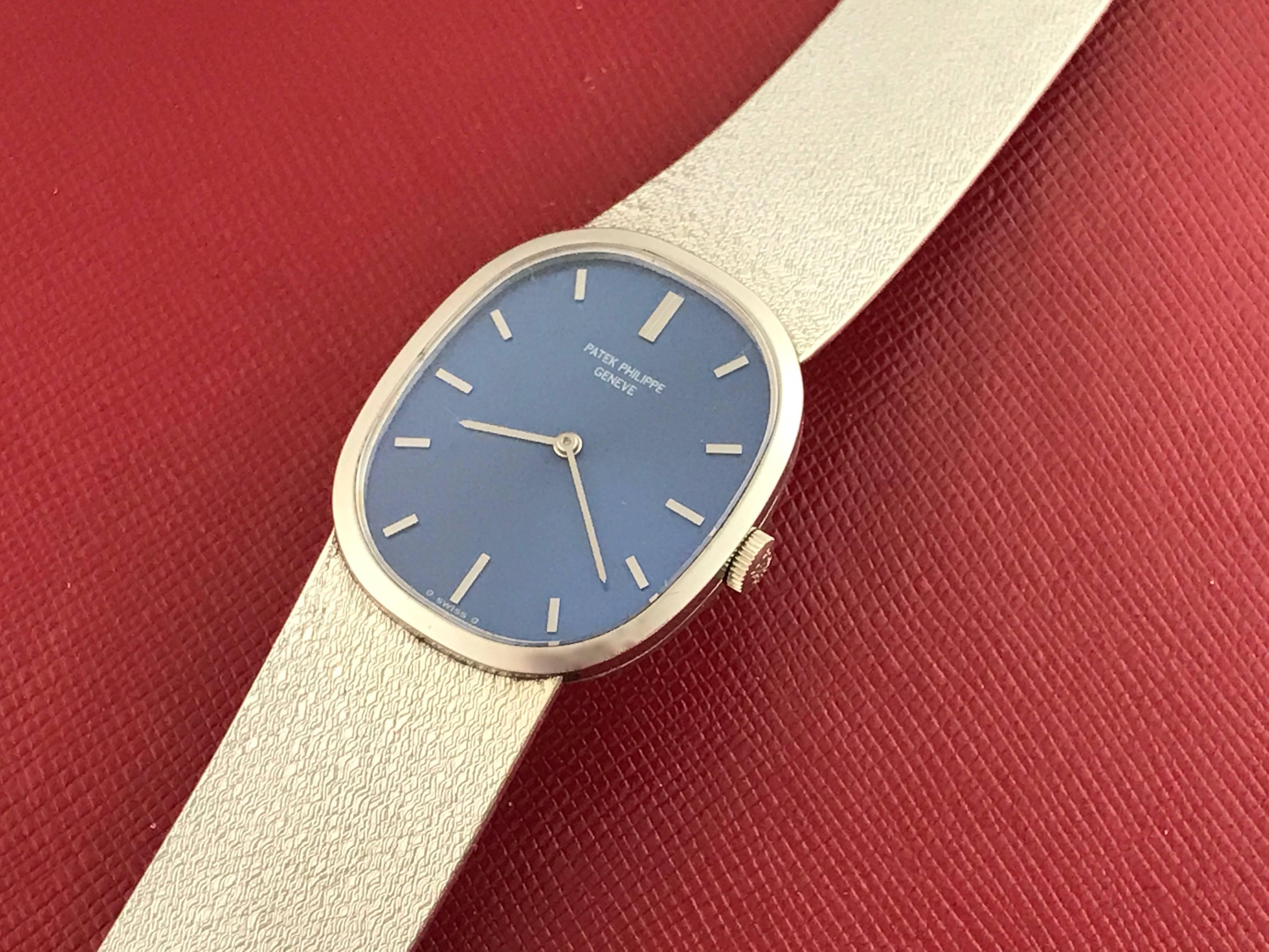 Patek Philippe Ladies 3545/2 Wrist Watch in 18K White  Gold. This is an heirloom piece you can pass down for generations.  This timepiece features an 18K white Gold ellipse case, measuring 27x32mm in diameter.  Blue Dial with Patek Philippe polished