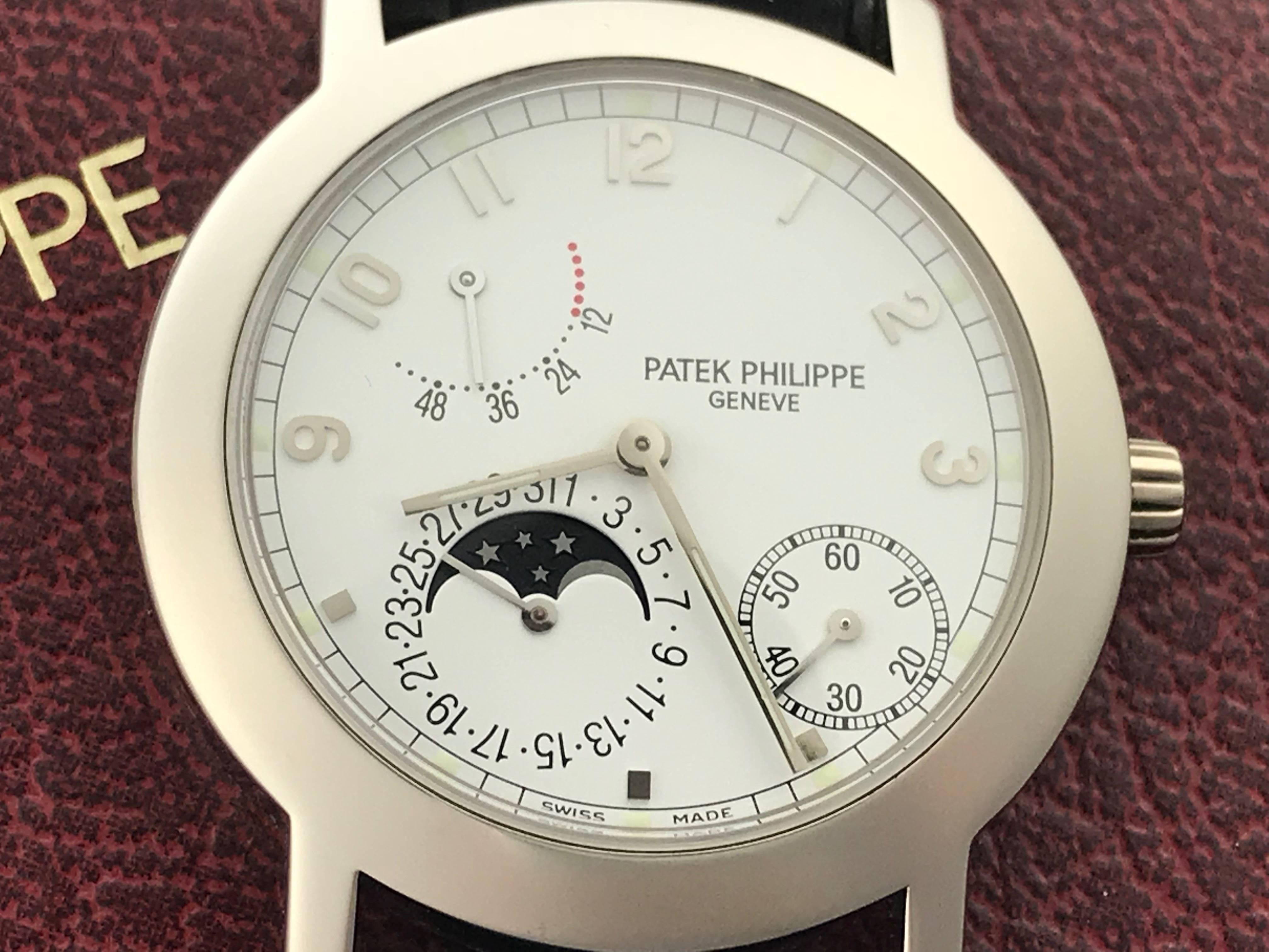 Patek Philippe 18k White Gold Moonphase Mens automatic wind Wrist Watch. Model 5055 G/001. Moonphase Date with Power Reserve Indicator and Off-set Constant Seconds. Patek Philippe Caliber 240/164.  18k White Gold case with exposition back to view