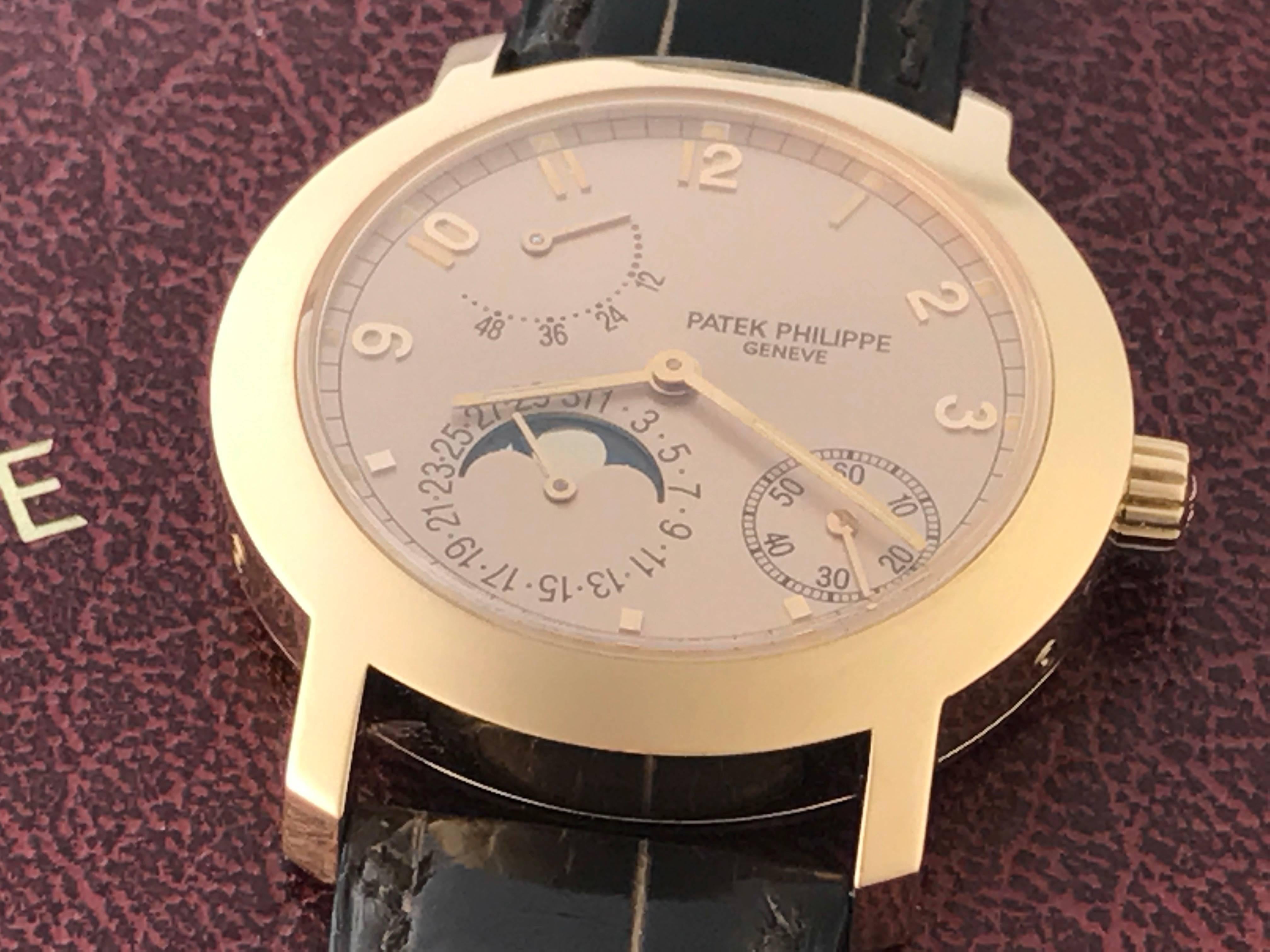 Patek Philippe 18k Rose Gold Moonphase Mens Automatic wind Wrist Watch. Model 5055R-001. Moonphase - Date with Power Reserve Indicator. Patek Philippe Caliber 240/164 with Twenty-Nine Jewels.  18k Rose Gold case with exposition back to view movement