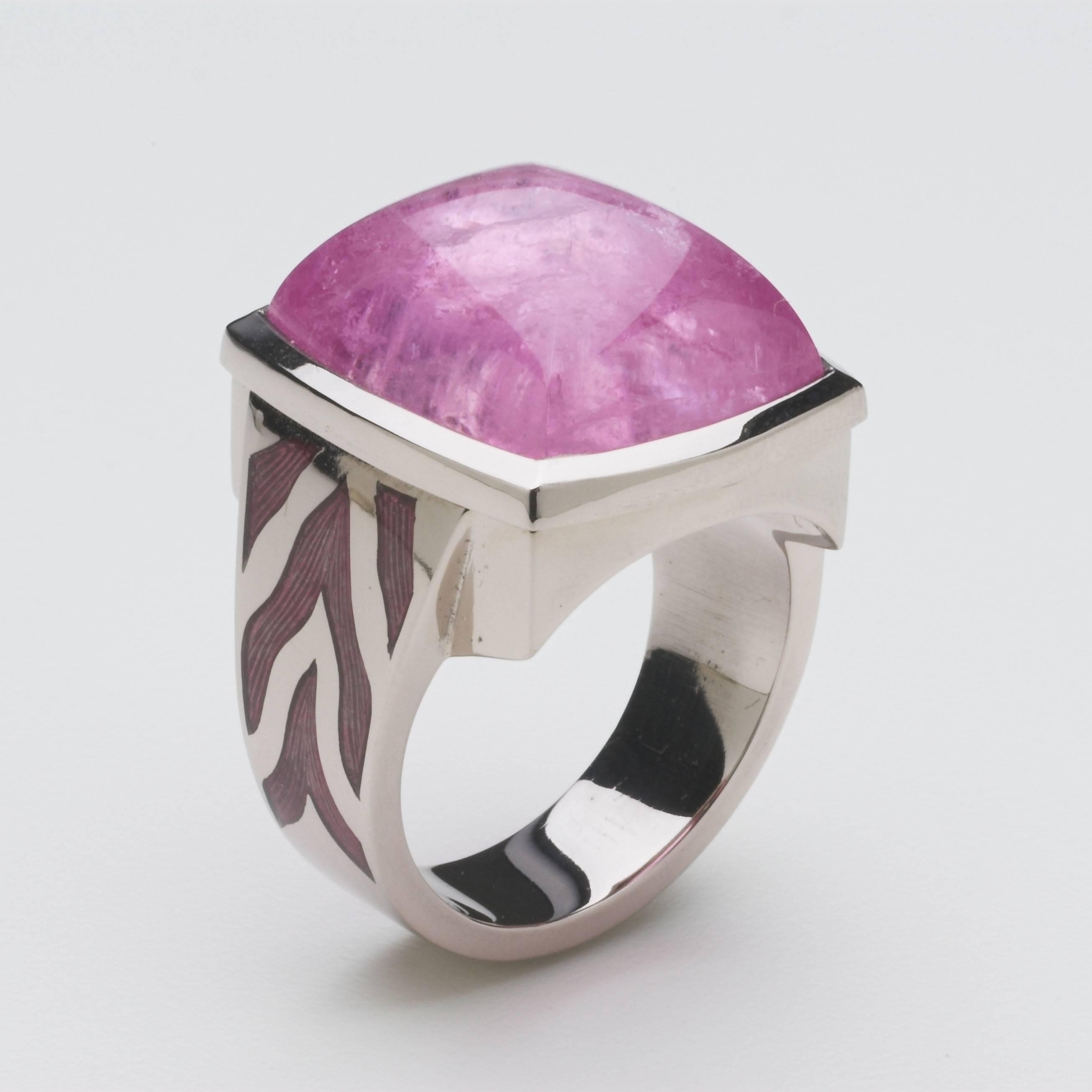 18ct white gold Sweetie ring set with a 16.77cts baby pink tourmaline sugarloaf cabochon, the shoulders of the ring are enamelled in a transparent pink to echo the stone. UK ring size O.