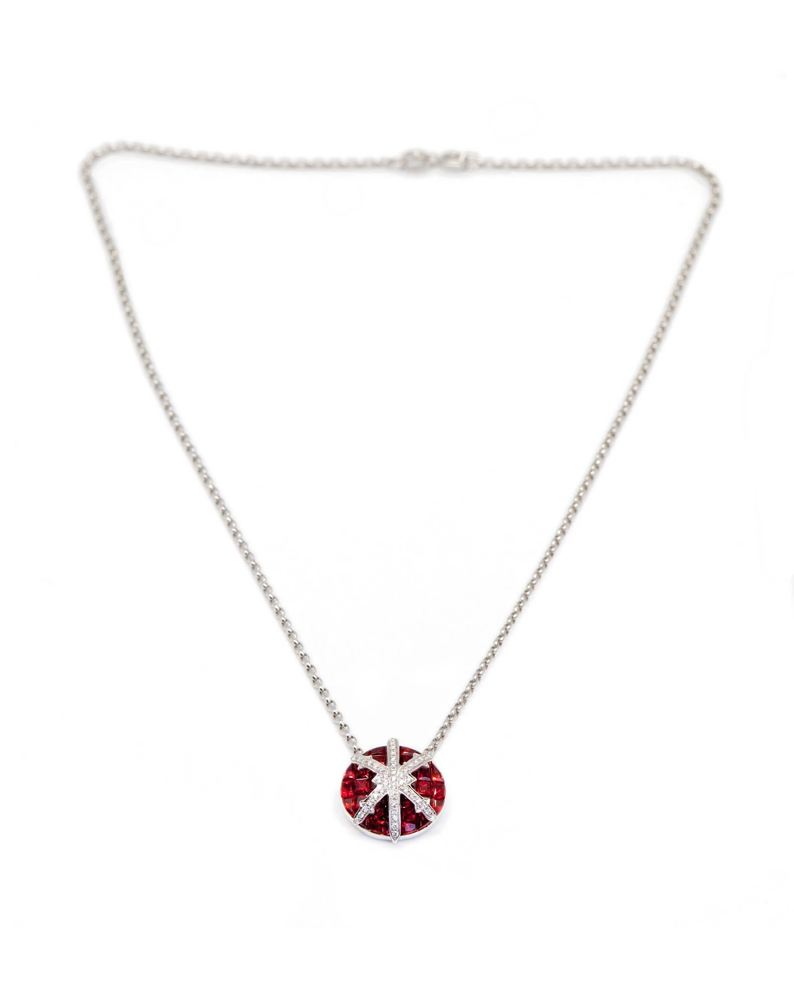 The STENMARK ruby, diamond and 18 karat white gold pendant features the elegant gemstone setting technique where square cut stones are set without metal prongs, creating a jewel with high colour impact. Banded with a jeweled snowflake of 45 x 1 mm G