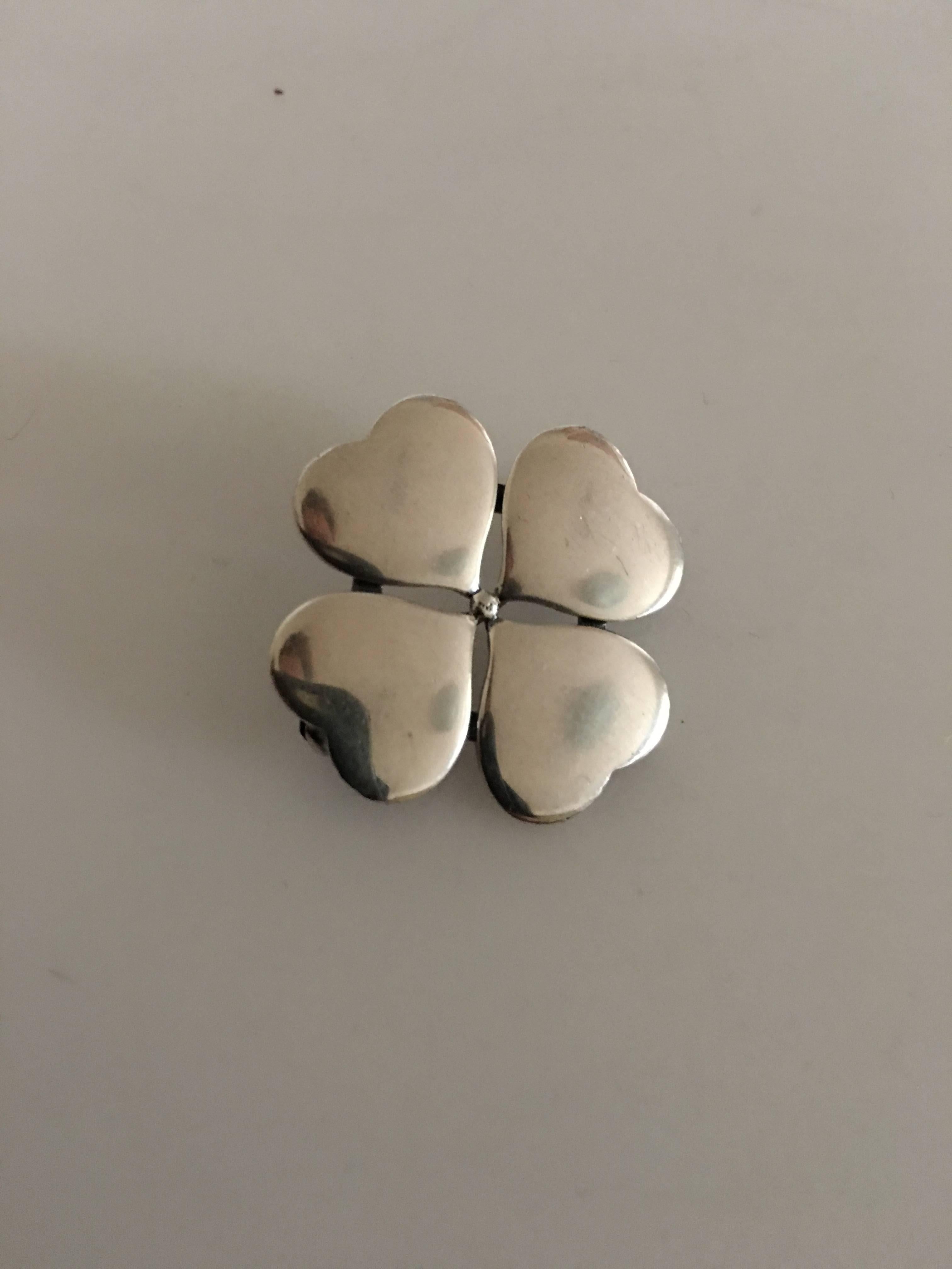 Hans Hansen Sterling Silver Brooch of 4 Hearts No. 108. Measures 2.5 cm diameter. Weighs 7 grams (0.20 oz). In fine condition.