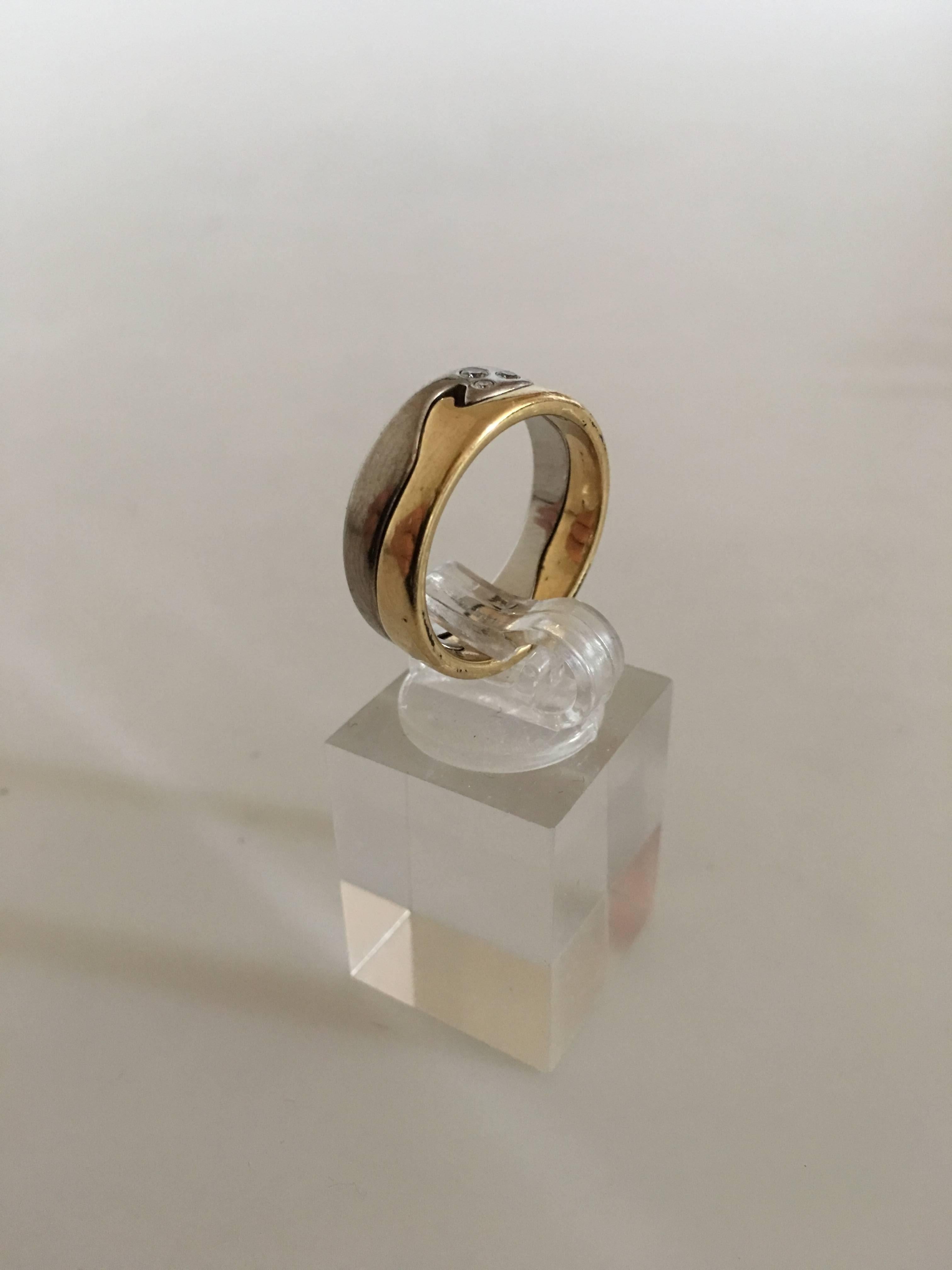 Georg Jensen 18K Gold Fusion Ring with Three Diamonds. Size 56 (US Size 7 ½). Weighs 10 grams.