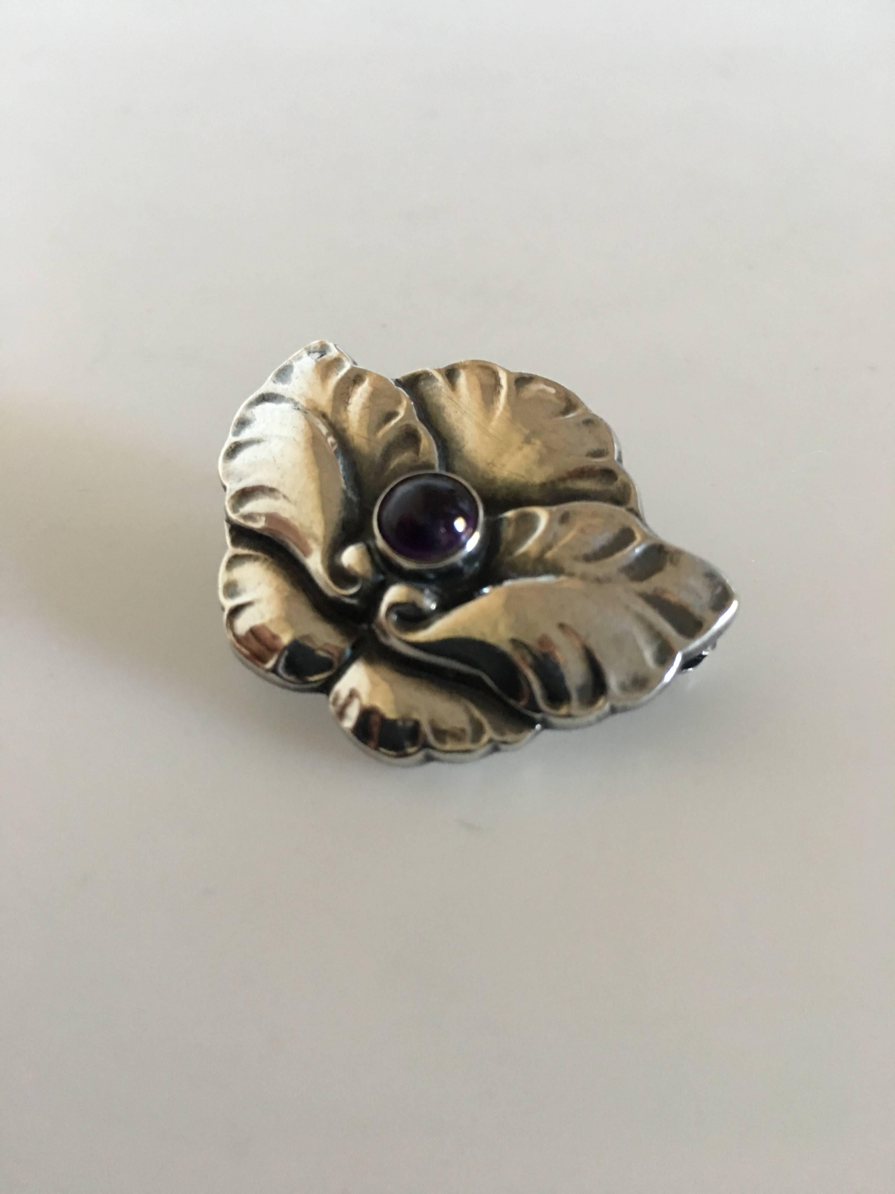 Georg Jensen Sterling Silver Brooch No. 407 with Amethyst. 3.5 cm. Weighs 8 grams. From after 1945.