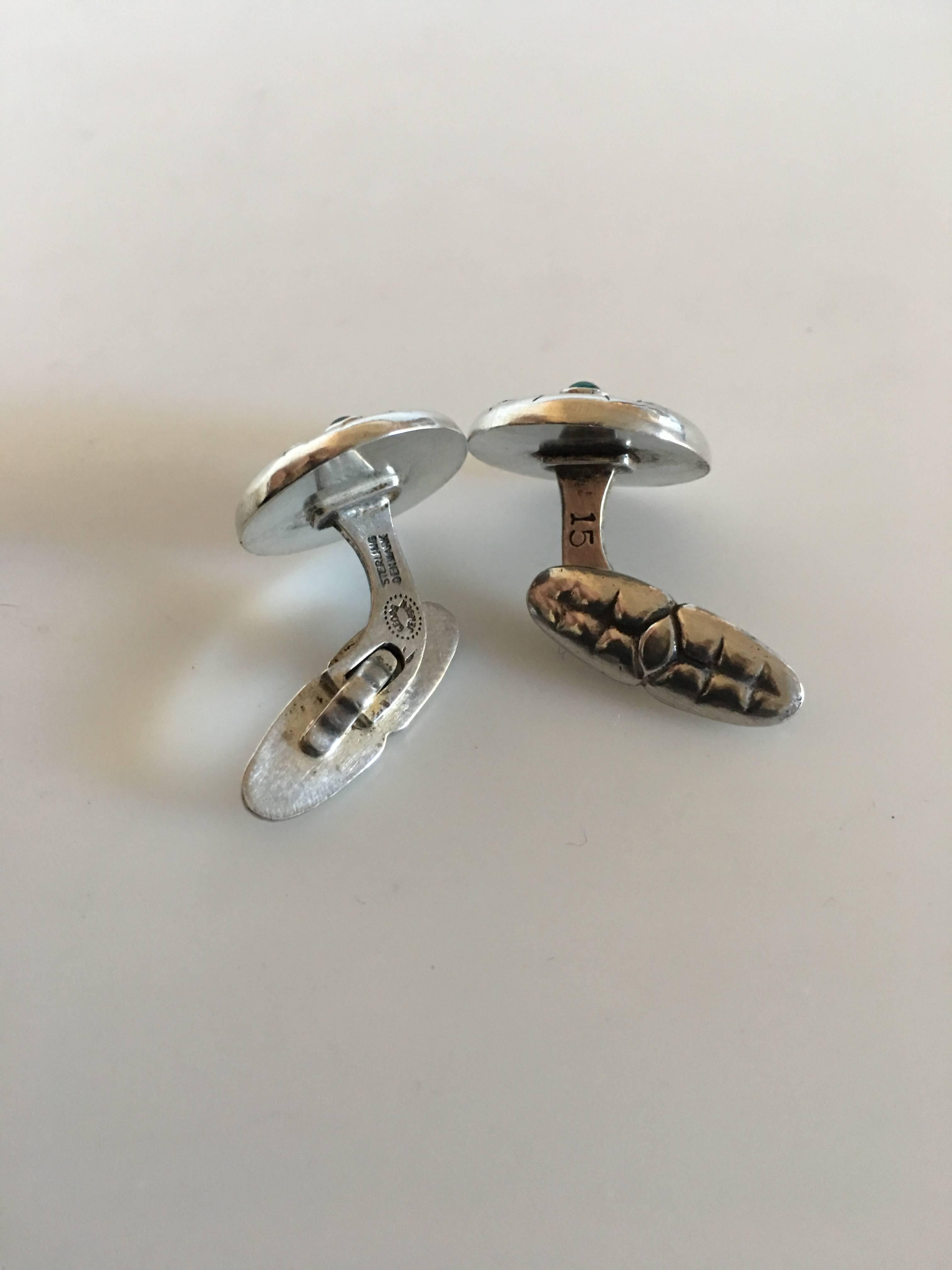 Georg Jensen Sterling Silver Cufflinks No. 15 with Green Agates. Measures 1.6 cm diameter. Combined weight of 11 grams. From after 1945