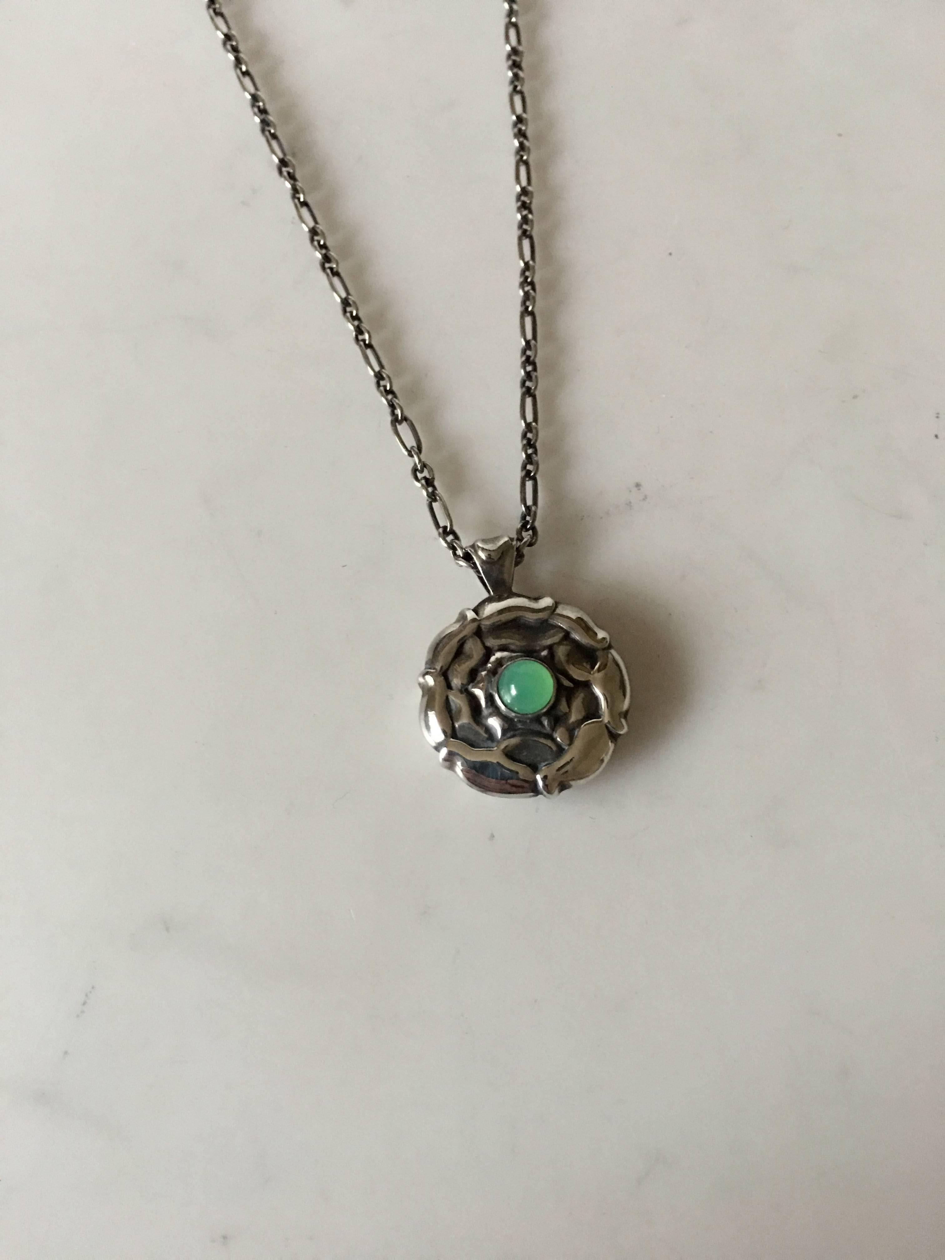 Georg Jensen Sterling Silver Necklace with Green Stone. Pendant measures 2 cm diameter. Chain measures 44 cm L (17 21/64