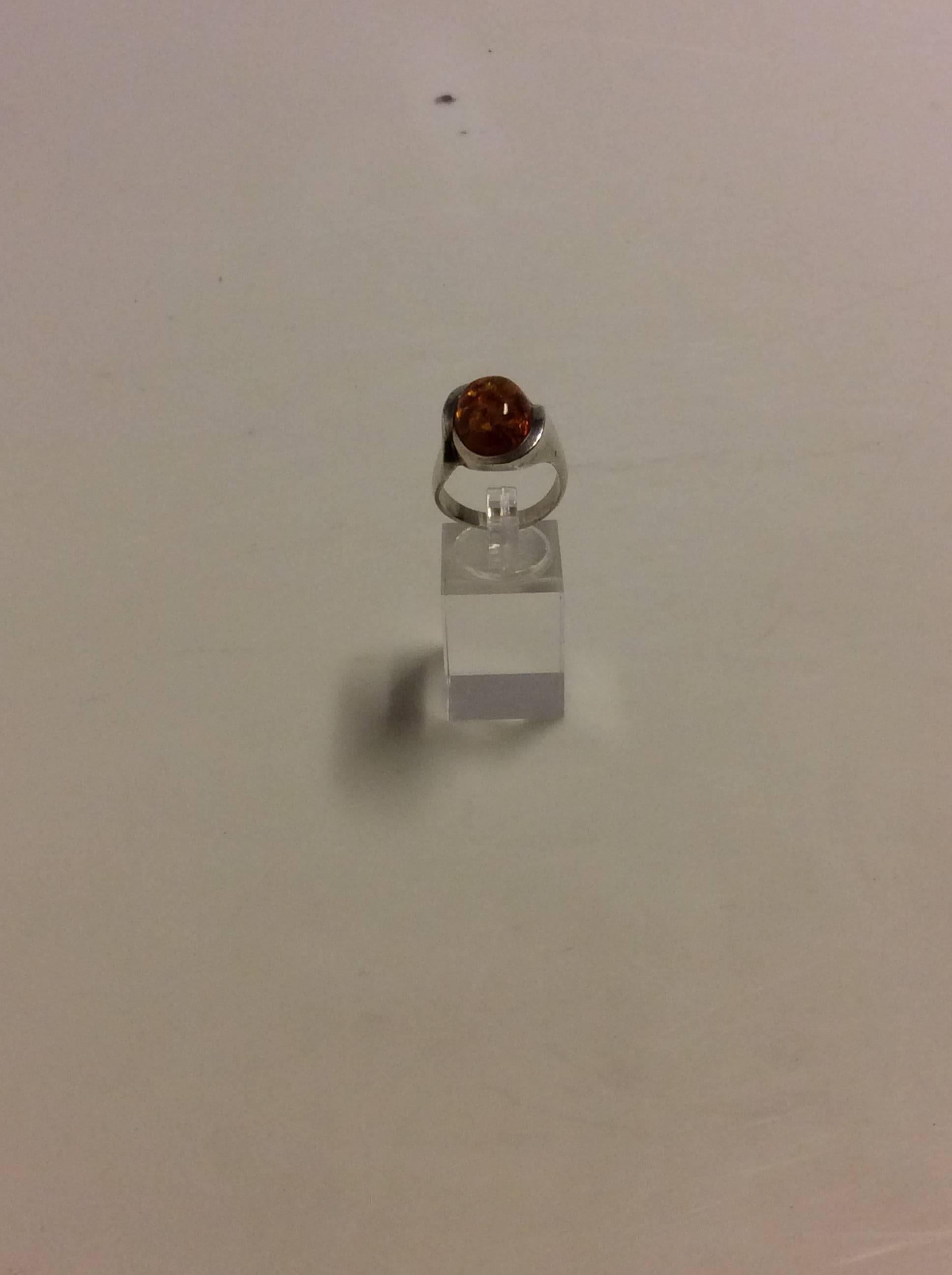 Niels Erik From Sterling Silver ring with Amber.

Ring size is 58 or US 8 1/2

Weight is: 9.71 grams / 0.342 oz.
